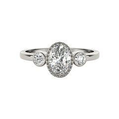 GIA 1.20 Carat Oval Textured Bezel Three-Stone 18K White Gold Diamond Ring
