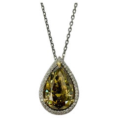 GIA 12.11 Carat Fancy Deep Brownish Greenish Yellow Pear Shape Diamond Necklace.