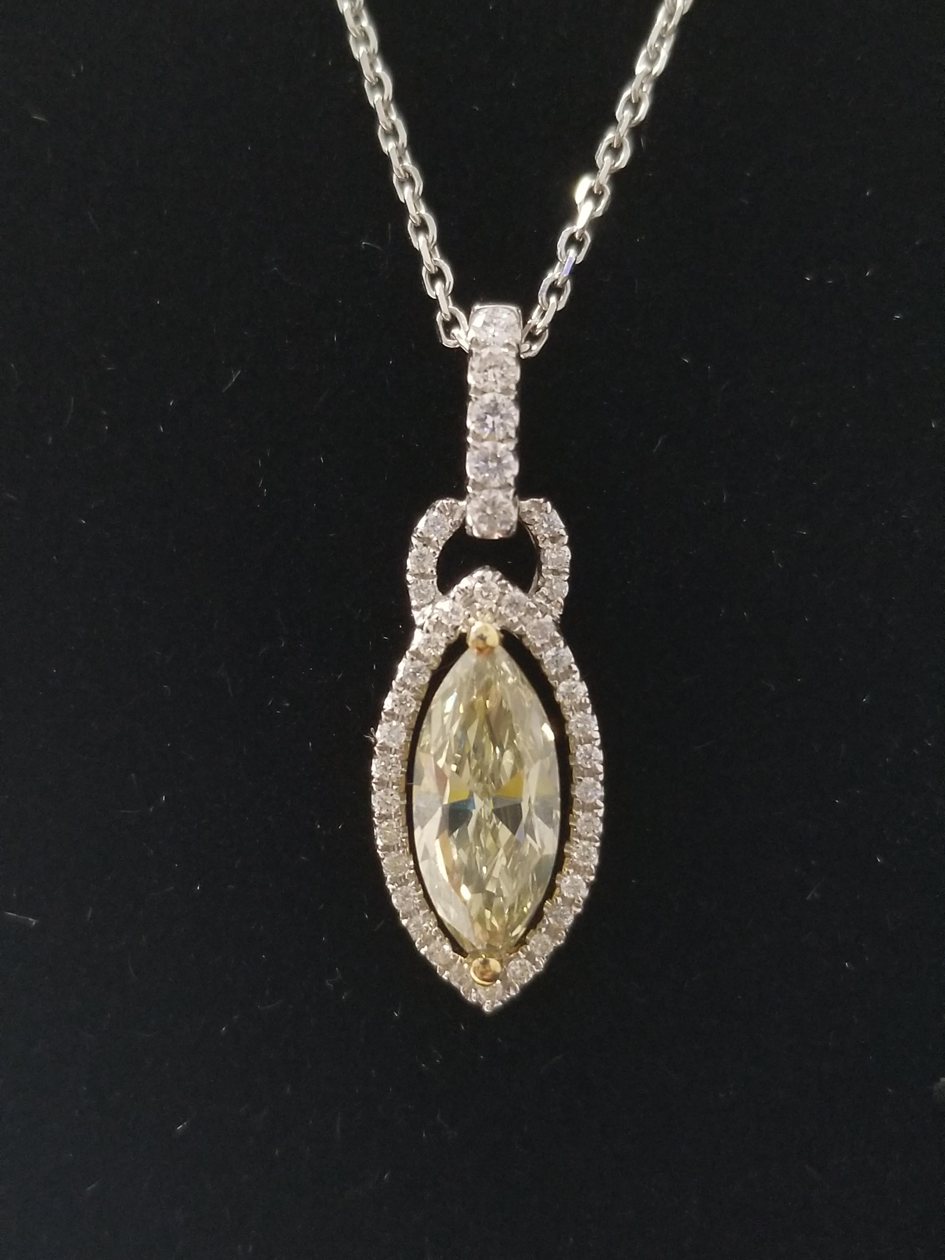Gorgeous fancy gray-greenish yellow color Marquise cut diamond , unique color combination cushion weighing 1.23 ct, surround by mixed white marquise and round brilliant cut diamonds. set in 14k white gold. pendant measures approximately 1 inch