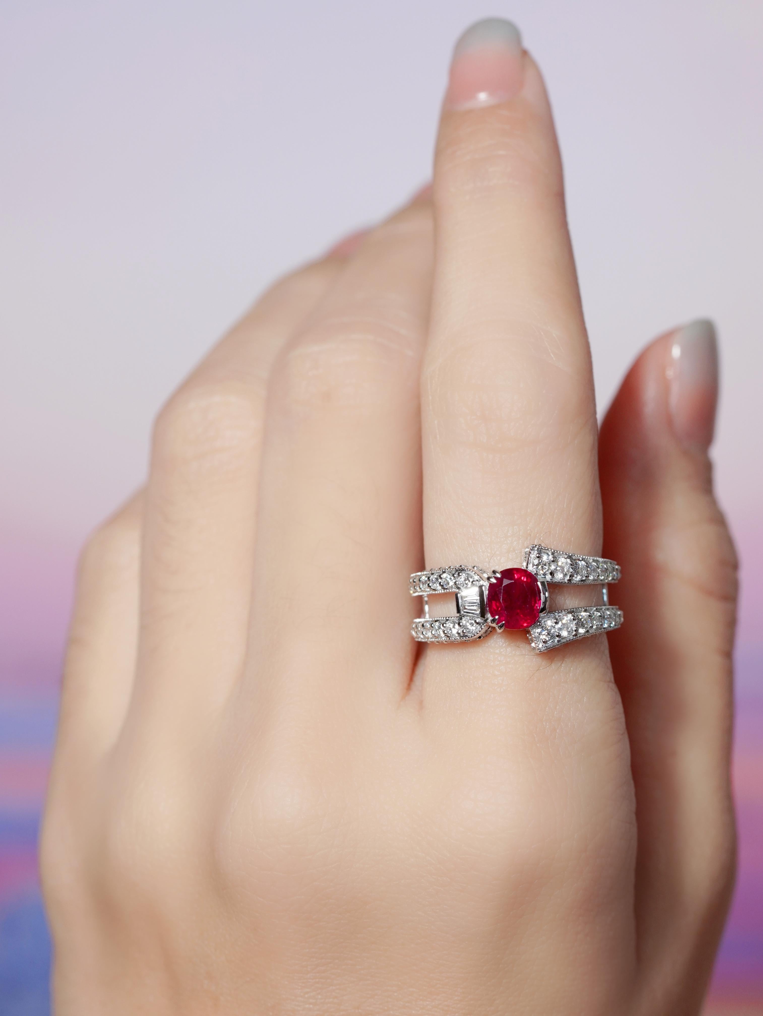 Celebrate love with this stunning Deco-style engagement ring. A vivid GIA certified round cut 1.24 carat ruby takes center stage, securely set in elegant prongs. Dazzling diamonds on the shoulders add sparkle and timeless grace. Perfect for a bold,