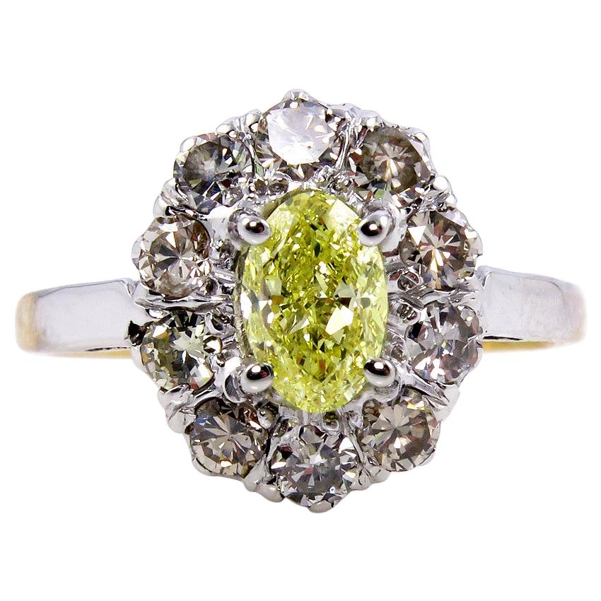 GIA 1.28 Carat Fancy Intense Yellow Oval Diamond Platinum and Yellow Gold Ring