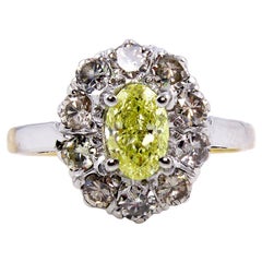 GIA 1.28 Carat Fancy Intense Yellow Oval Diamond Platinum and Yellow Gold Ring