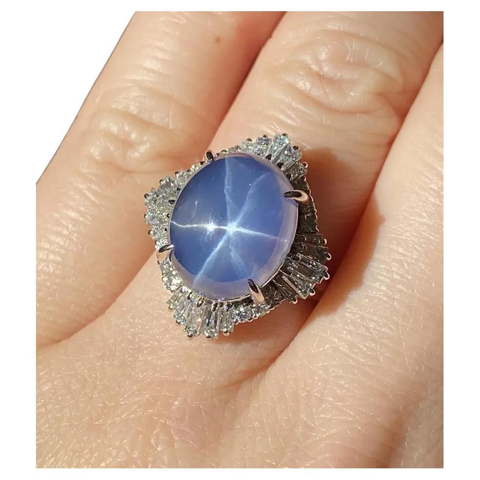 GIA Certified 12.95 carats Oval Star Sapphire & Diamond Ring in Platinum

Star Sapphire & Diamond Ring features an Oval Shaped Violetish Blue Star Sapphire surrounded by Baguettes and Round Brilliant Cut Diamonds set in Platinum Ballerina setting