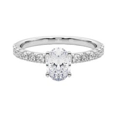 GIA 1,2ct Solitario ovale con mezza eternità in oro bianco 18 carati
