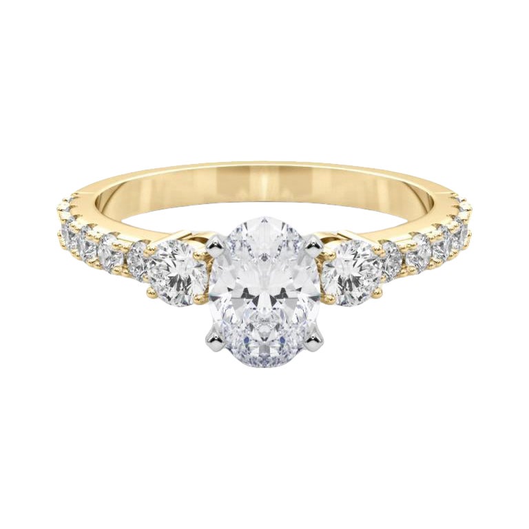 GIA 1,2ct Anello ovale a tre pietre con gambo di diamante in oro giallo 18 carati