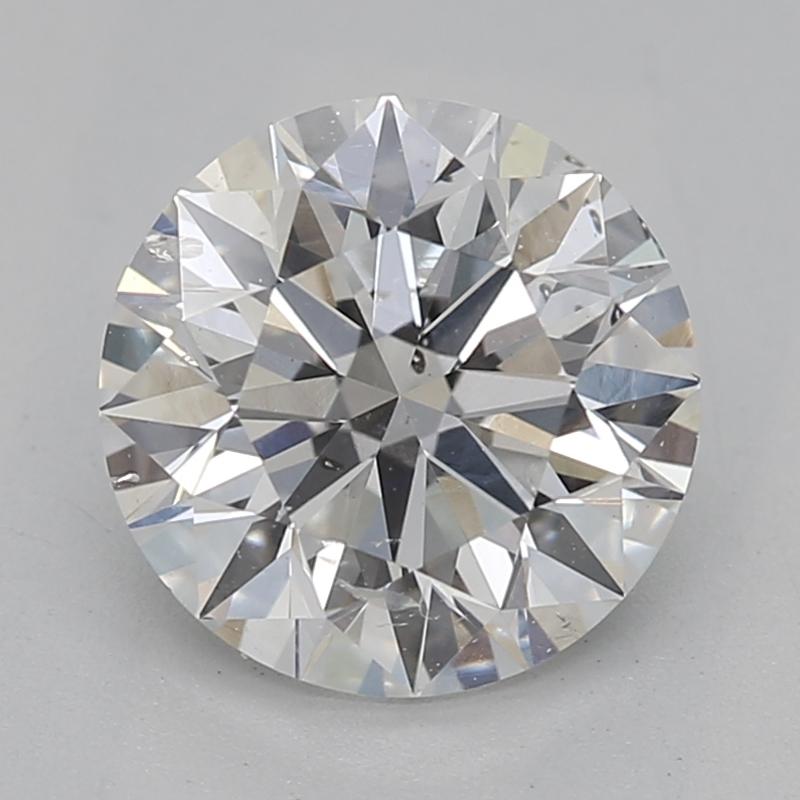 Hecho a mano en Nueva York, este exquisito anillo de diamantes presenta una impresionante pieza central de un diamante redondo de 1,2 , que irradia un brillo hipnotizador con su notable graduación E y SI2. Fabricada en lujoso platino, la banda luce