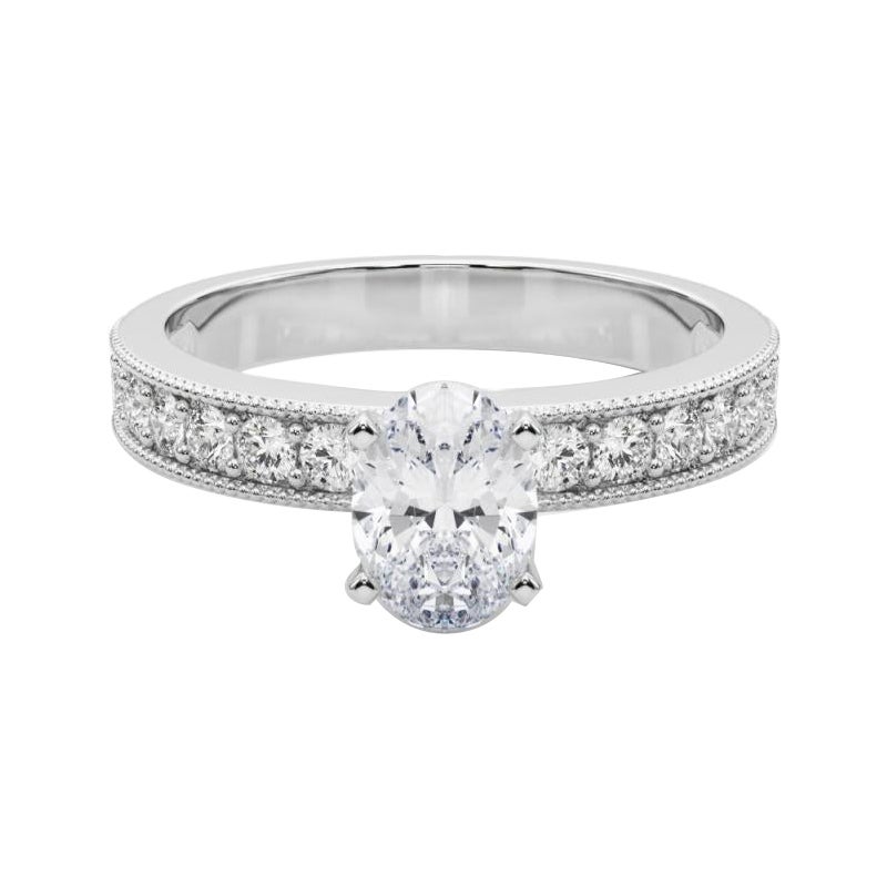 GIA Anello con diamante ovale vintage da 1,3 carati con canale a grana grossa in oro bianco 18 carati