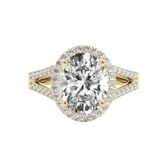 GIA 1,31ct Anello con diamante ovale aureolato a cesto aperto in oro giallo 18 carati