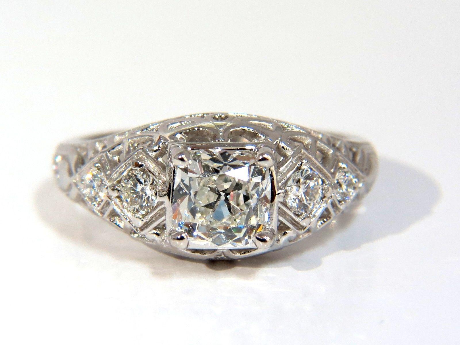 Cushion Vintage Revival



GIA 1.04ct. Cushion cut diamond ring.

G-color

Si-1 clarity

Report Id: 2145774134

Please see attached photo for report. 

5.84 - 5.83 X 4.01

Excellent Brilliance.



.28ct. Round, full cut diamonds.

G Color Vs-2
