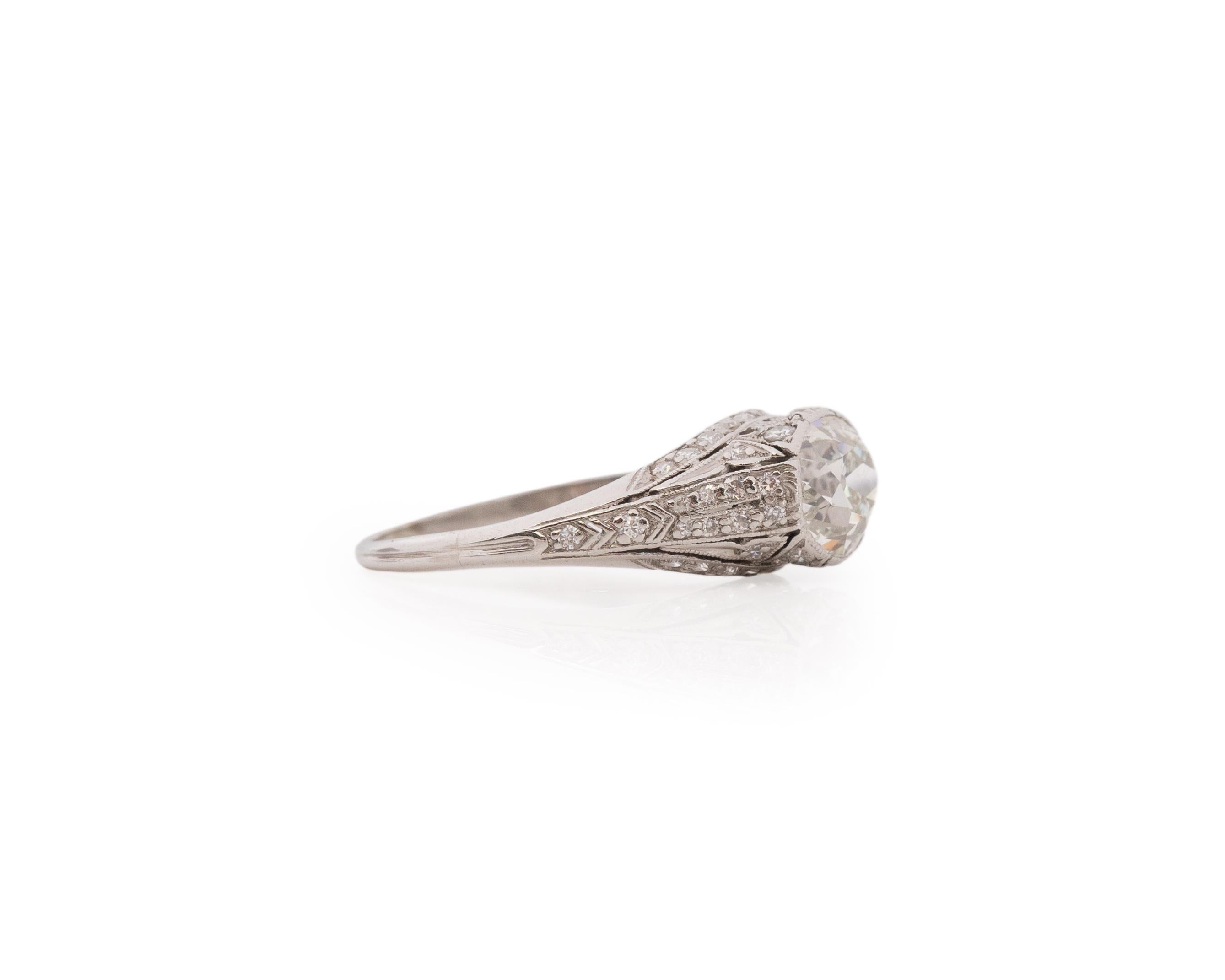 Ring Size: 6.5
Metal Type: Platinum [Hallmarked, and Tested]
Weight: 4.1 grams

Center Diamond Details:
GIA LAB REPORT #:5222897038
Weight: 1.33ct
Cut: Old Mine Brilliant
Color: K
Clarity: SI2
Measurements: 6.76mm x 6.41mm x 4.40mm

Side Diamond