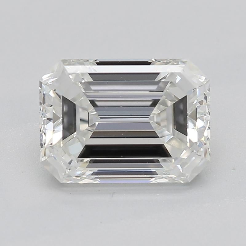 Crafted with a stunning interplay of elegance and nature, this remarkable diamond ring features a mesmerizing emerald center stone, weighing 1.50 and boasting an exquisite H and VS1 grade. The setting is artistically designed to emulate intertwined