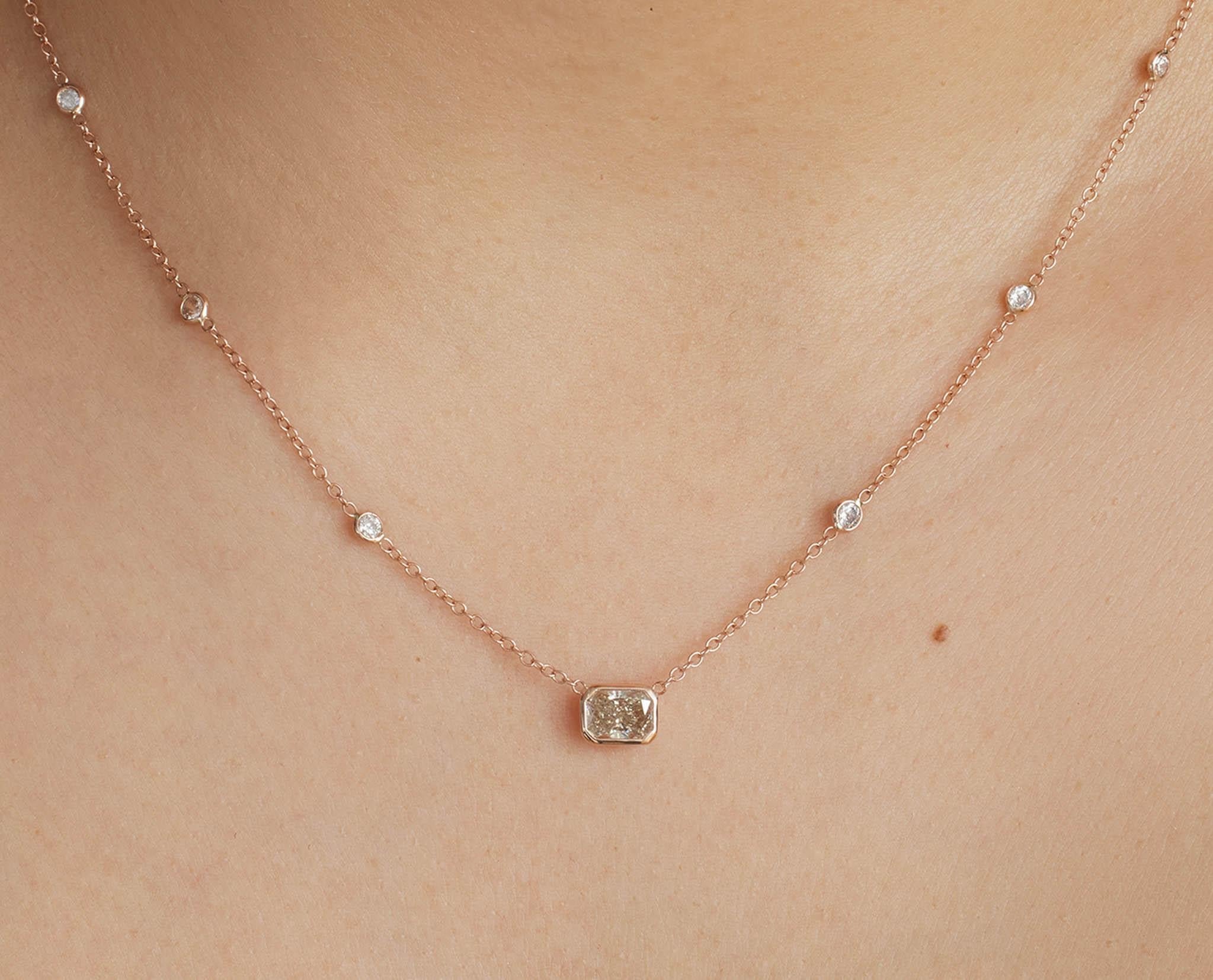 A wonderful Estate Diamond Pendant Necklace in 14k Rose Gold (tested). GIA Certified Center 0.91ct Radiant Diamond set into prong set in N, Very Light Brown color (color treated), I1 clarity. Very BRILLIANT, Warm Cognac color. The measurements are