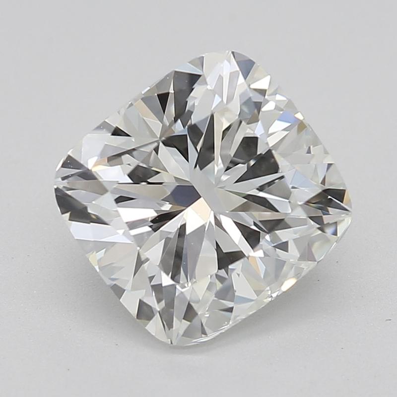 Handcrafted in New York, a stunning diamond ring that exemplifies timeless beauty and sophistication, featuring a captivating cushion center stone weighing 1.51 with a striking I and clarity of VS1. Its classic three-stone design is enhanced by two