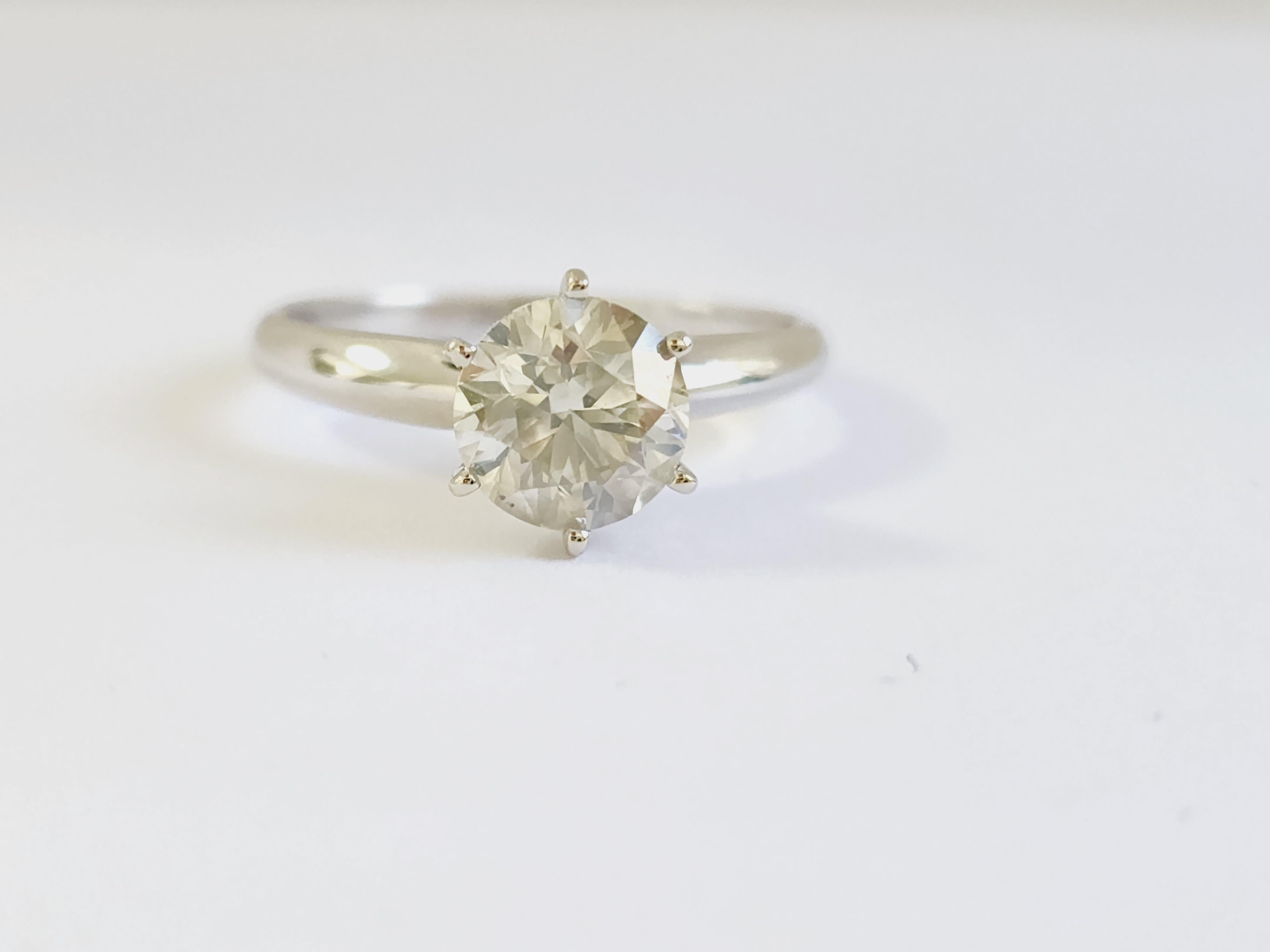 GIA 1.52 Carat Natural Fancy Light Gray Round Diamond Ring 14 Karat White Gold. Set on 6-prong 14K Solitaire white gold ring.
Ring size: 7