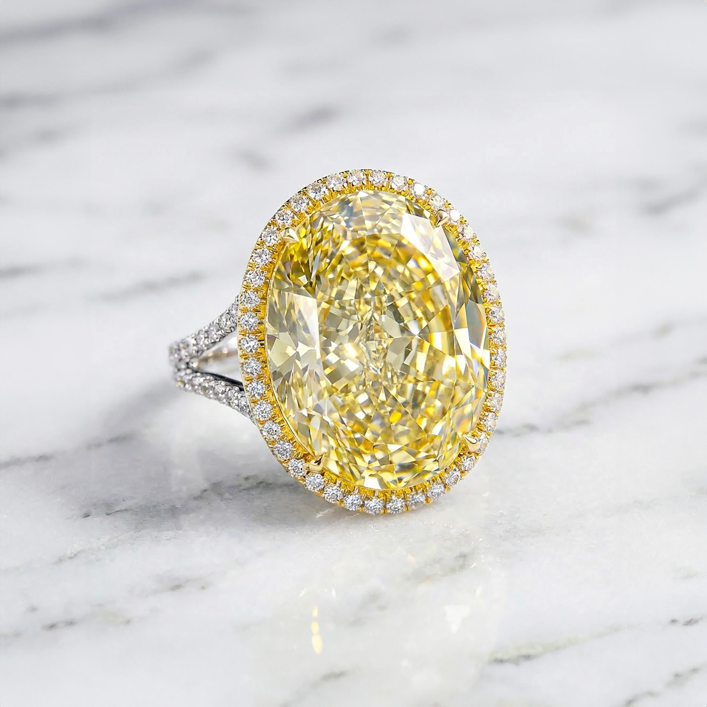Un spectaculaire diamant ovale Fancy Yellow de 15,29 carats, certifié par la GIA, trône au cœur de ce chef-d'œuvre exceptionnel en platine et en or jaune 18 carats. Ce diamant jaune fantaisie VS1 offre une combinaison rare de taille, de pureté et de