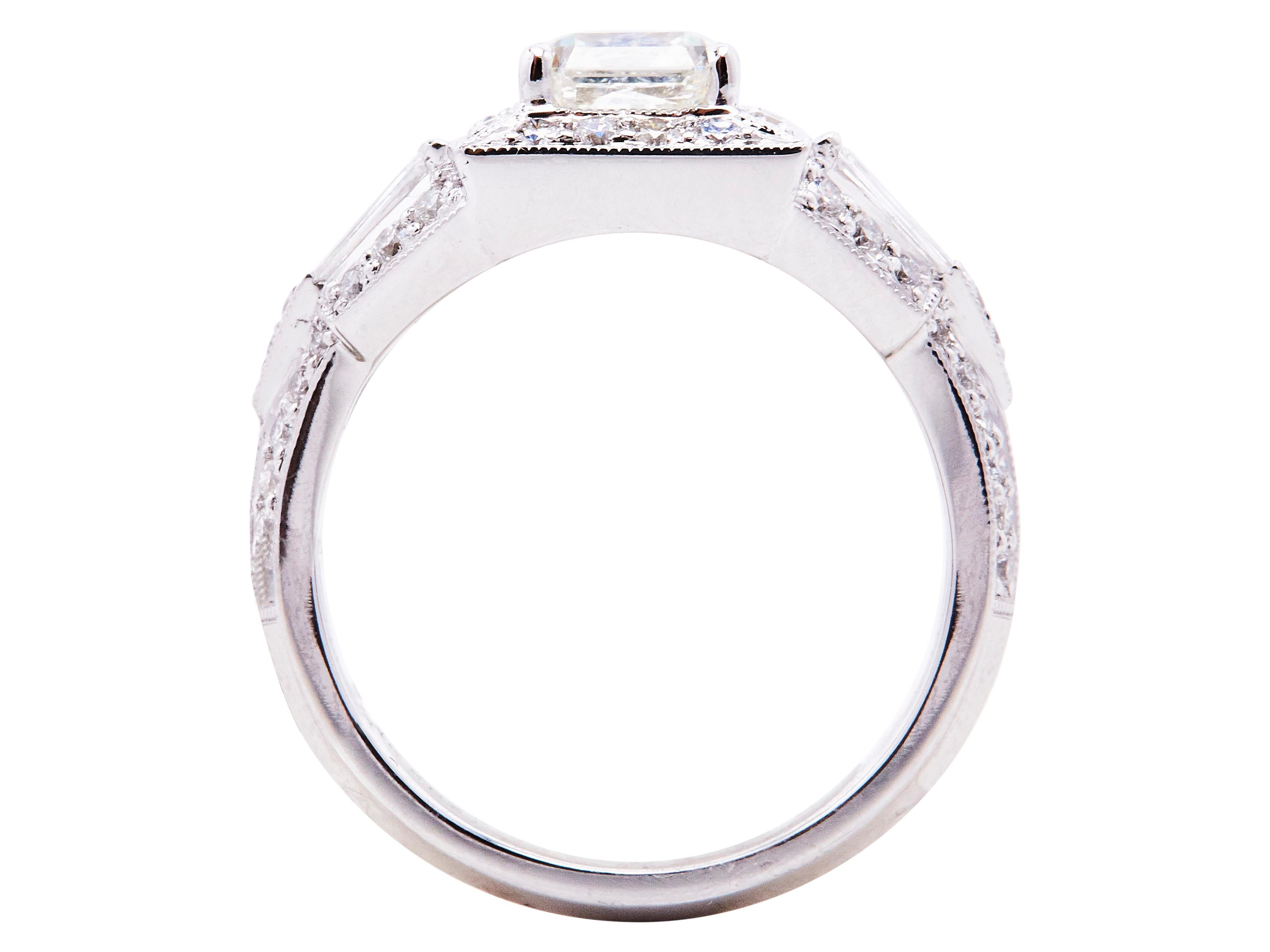 This beautiful and unique 18kt White Gold Radiant Cut vintage-inspired ring is a classic piece. The center Radiant Diamond is 1.53-carat and accented by 4 beautiful 0.25-carat Taper Baguette Diamonds and surrounded by 56, 0.52 Brilliant Round