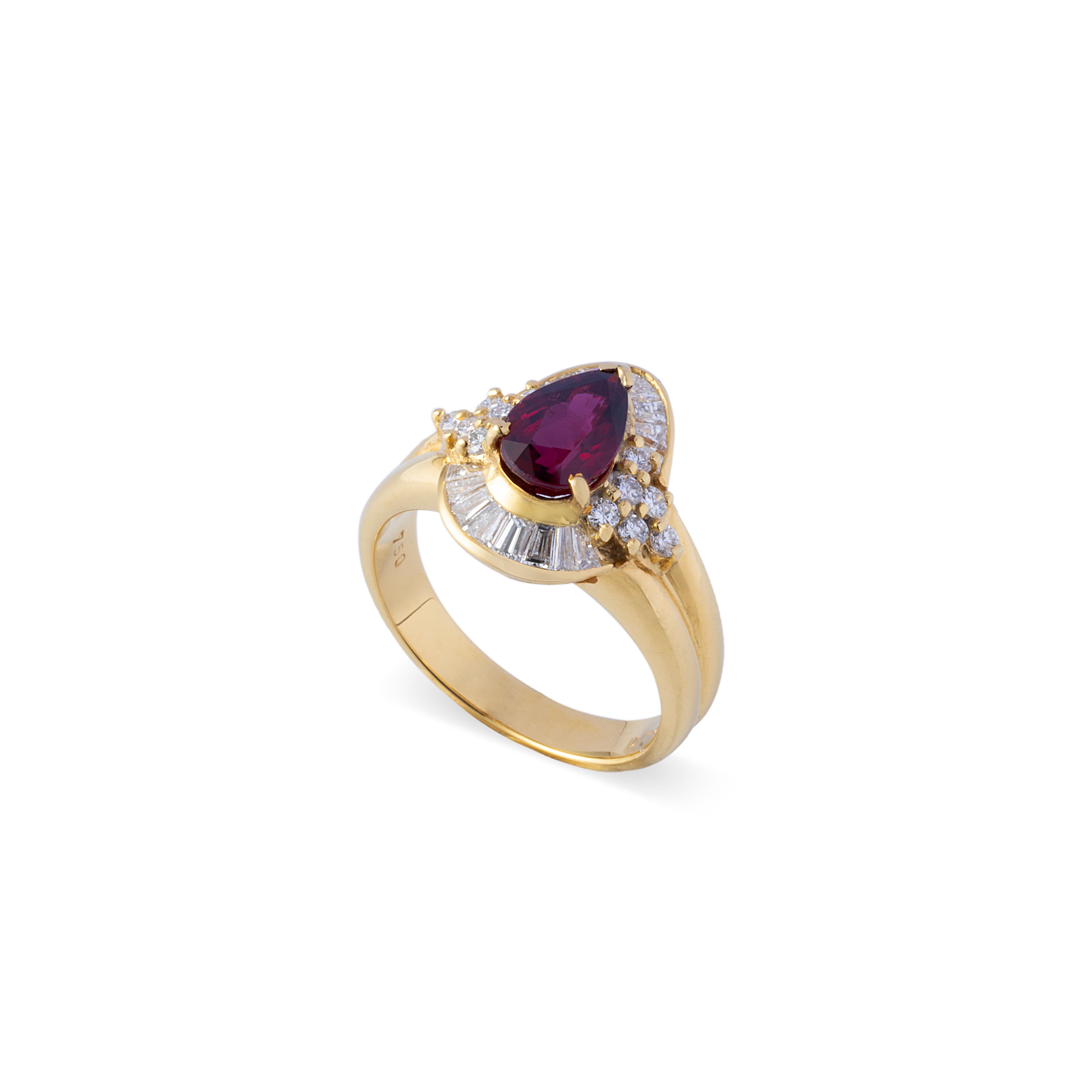 This amazing one-of-a-kind vintage cocktail ring boasts a pear cut ruby of 1.54 carats accompanied by GIA certificate. The stunning pear cut ruby is heavily surrounded by high grade natural tapered baguette and brilliant cut diamonds. Immaculate