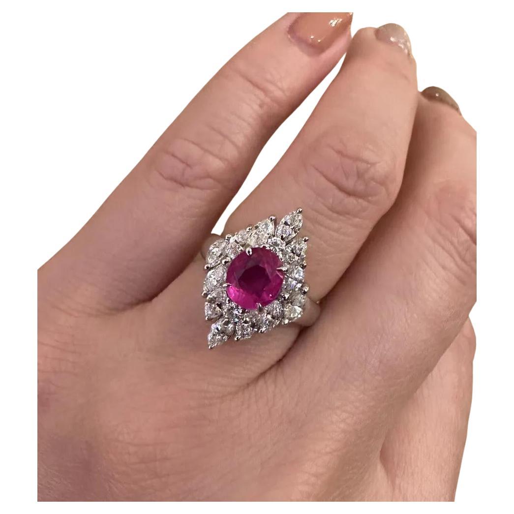 GIA Certified 1.56 Carat Natural Unheated Ruby and Diamond Ring in Platinum

Ruby and Diamond Ring features a 1.56 Carat Natural Purple-Red Oval Ruby surrounded by 14 Marquise and Round Brilliant Diamonds set in Platinum.

The Ruby originates from