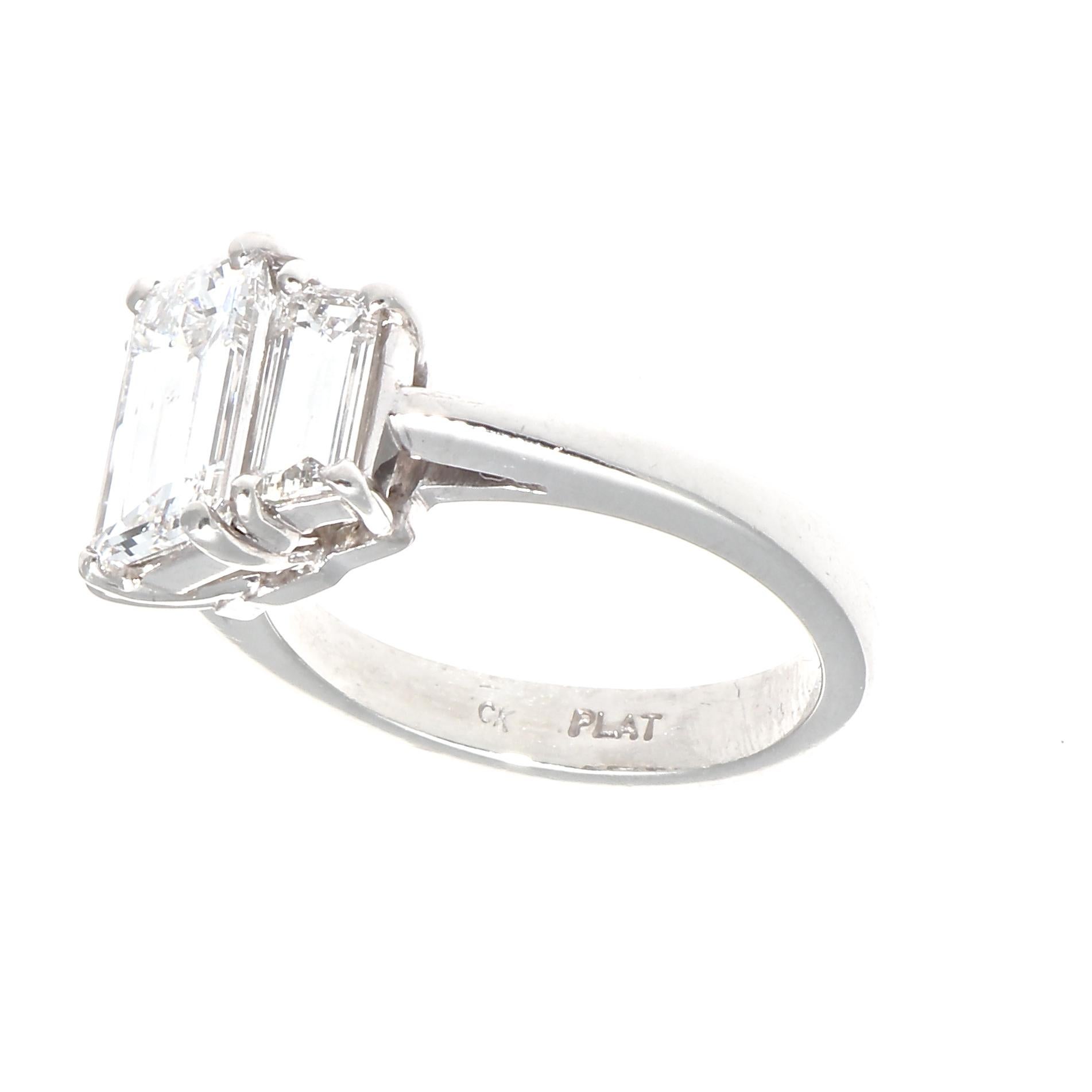 A design as timeless as an everlasting marriage. The classic three stone engagement ring featuring a 1.57 carat emerald cut diamond that is GIA certified as F color, SI1 clarity. Crafted in platinum.

Ring size 5 and can easily be resized to fit, if