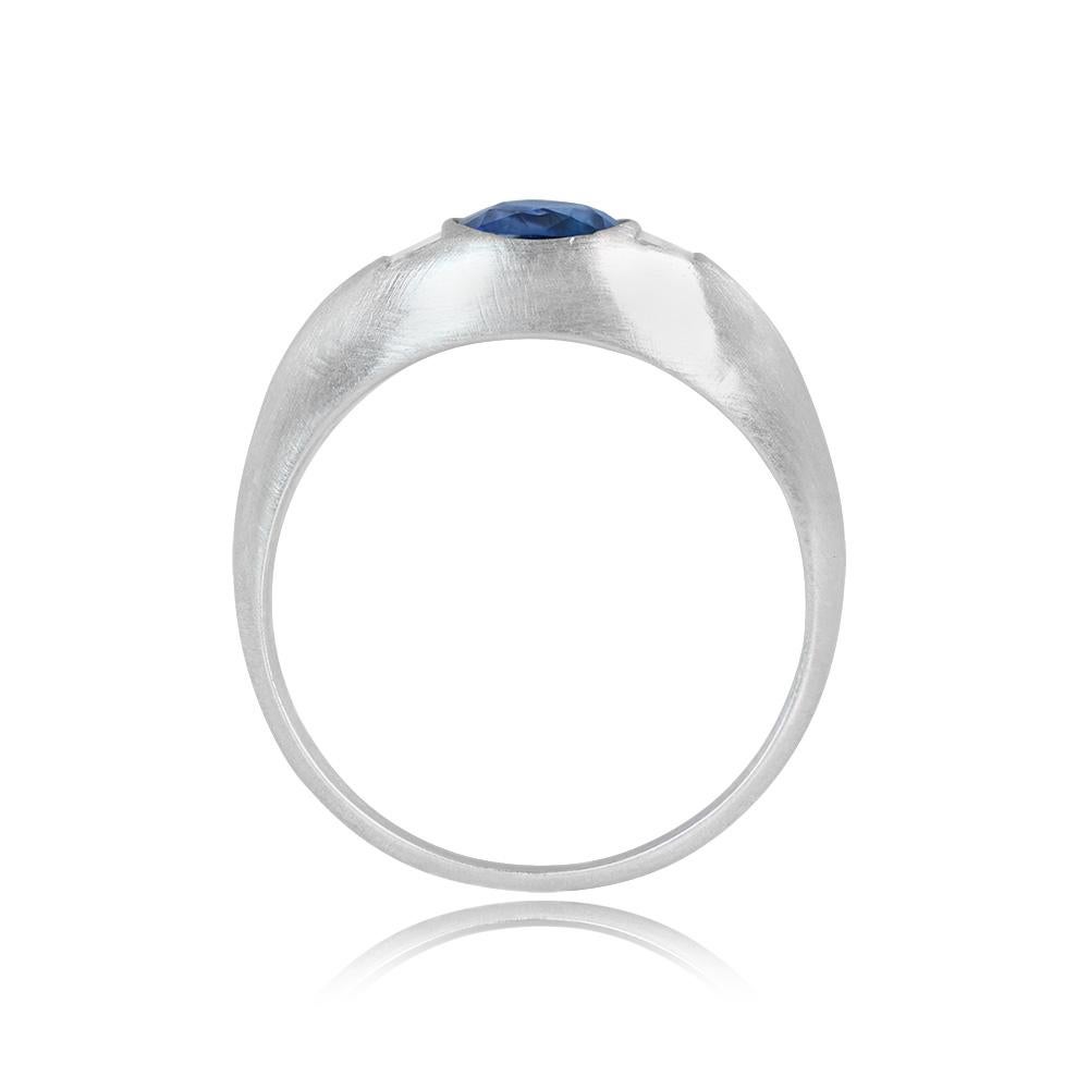 Presenting an exceptional and coveted three-stone ring, boasting a rare 1.58-carat cushion cut Kashmir sapphire, showcasing a vivid and strong blue color that captures the essence of this esteemed gemstone. Gracefully flanking the center sapphire