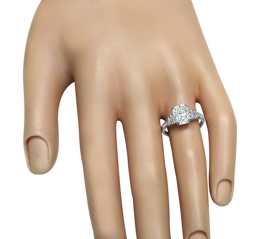 This is a stunning platinum engagement ring. The ring is centered with sparkling GIA certified cushion cut diamond that weighs 1.60ct. The color of the diamond is D with Internally Flawless clarity. The center diamond is accentuated by dazzling