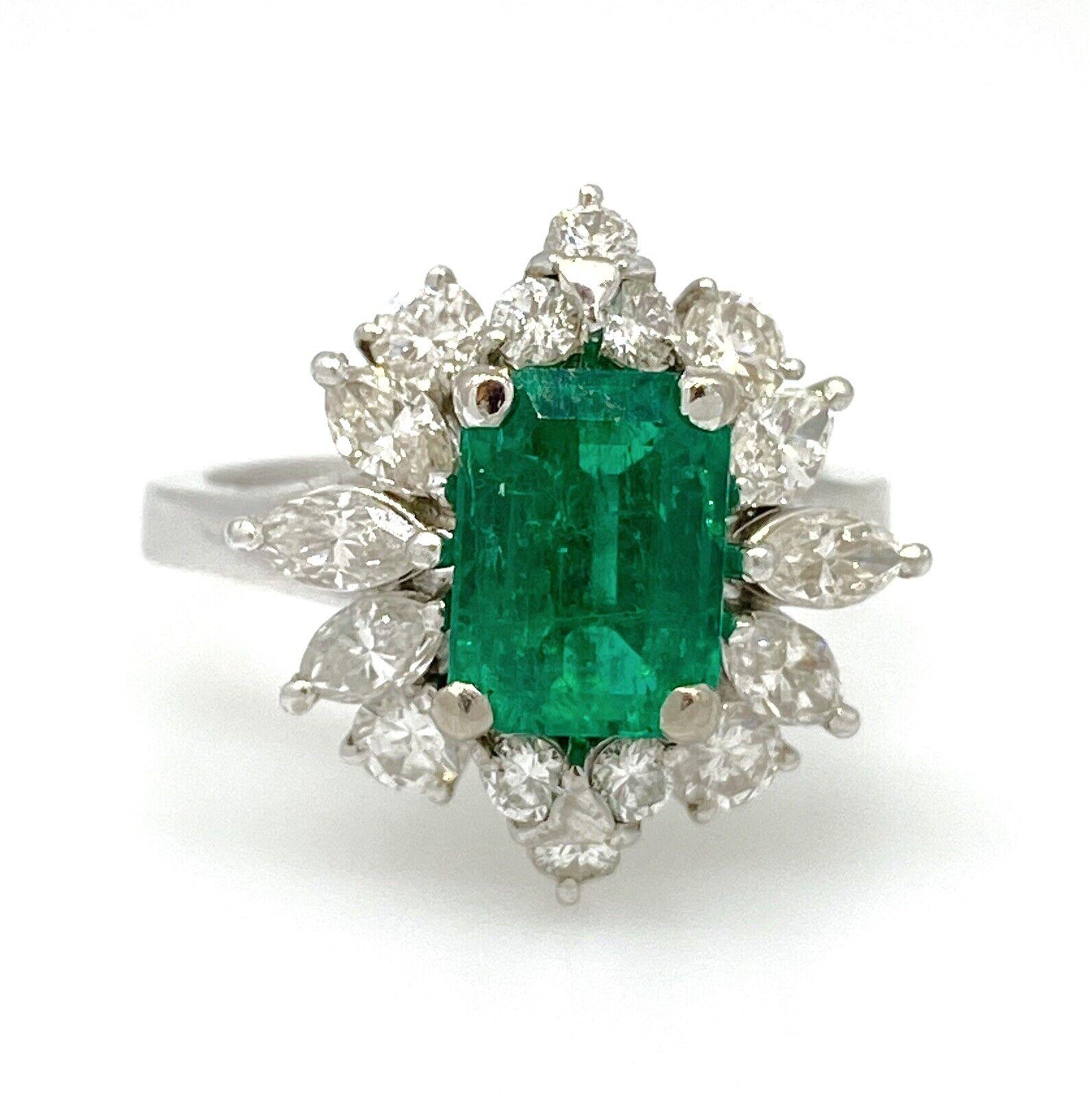 GIA Certified Emerald in a Vintage Diamond Setting 18k White Gold

Colombian Emerald & Diamond Ballerina Ring features a 1.62 carat Natural Emerald with beautiful vibrant green color accented by 6 Marquise and 10 Round Brilliant Diamond set in a 18k