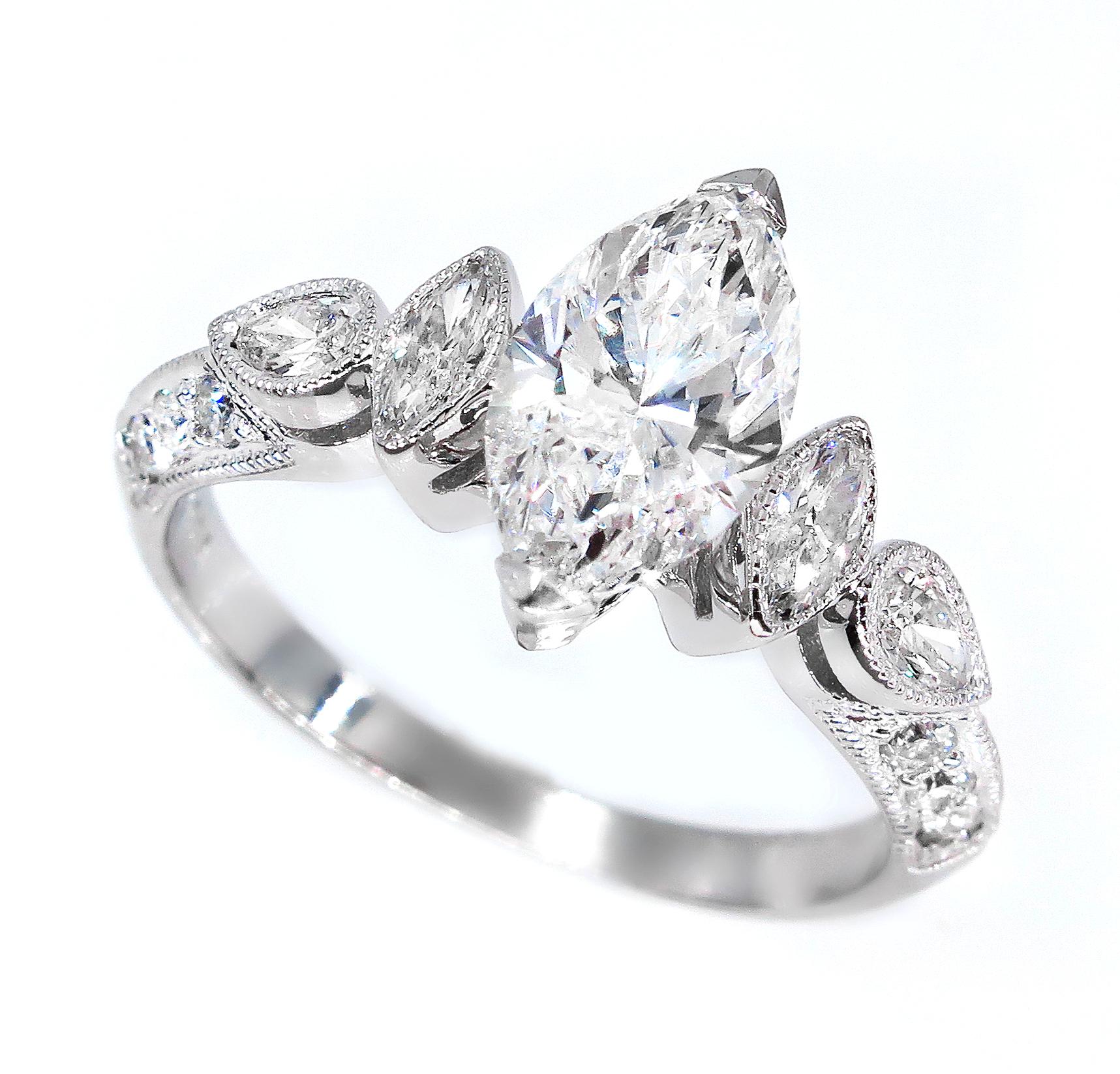 There is nothing more ELEGANT than this exquisite VINTAGE Style MARQUISE Diamond ring!
The main attraction of this Dazzler is the center Marquise Cut Diamond, weighing 1.12ct, G color, I1 clarity GIA CERTIFIED. GREAT CUT and AMAZING BRILLIANCE! Icy