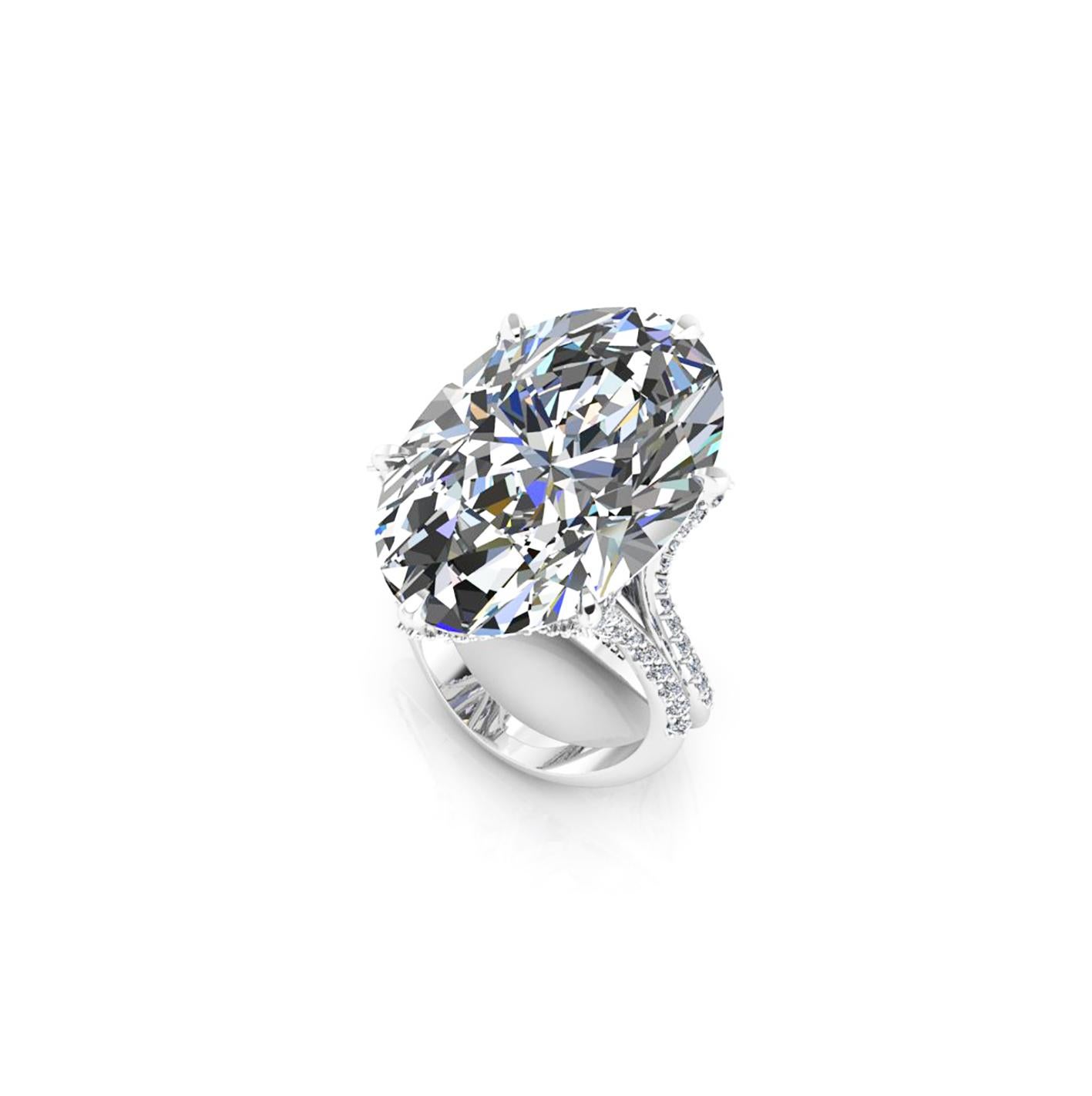 GIA Certified 16.37 carat Oval Diamond, set in a uniquely designed Platinum 950 ring with white diamonds pave' all over the surface of the ring creating an effect of morning dew, for an approximate carat weight of 0.78 carat, conceived with the best