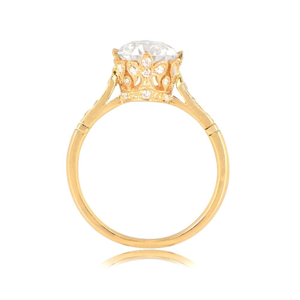 A crown-style engagement ring with a 1.63-carat GIA-certified old European cut diamond of F color and SI1 clarity. The under-gallery displays a diamond-studded crown, with four diamonds on each shoulder. It is handcrafted in 18k yellow gold.

Ring
