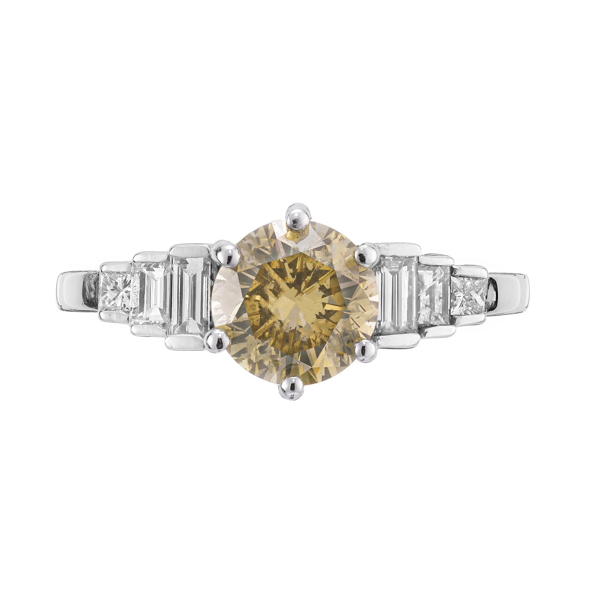 1960's natural brown and yellow diamond engagement ring. GIA certified round center stone in a 6 prong platinum setting with graduated baguette and princess cut side diamonds.  

1 round fancy yellow brown diamond, approx. total weight 1.64cts, SI2,
