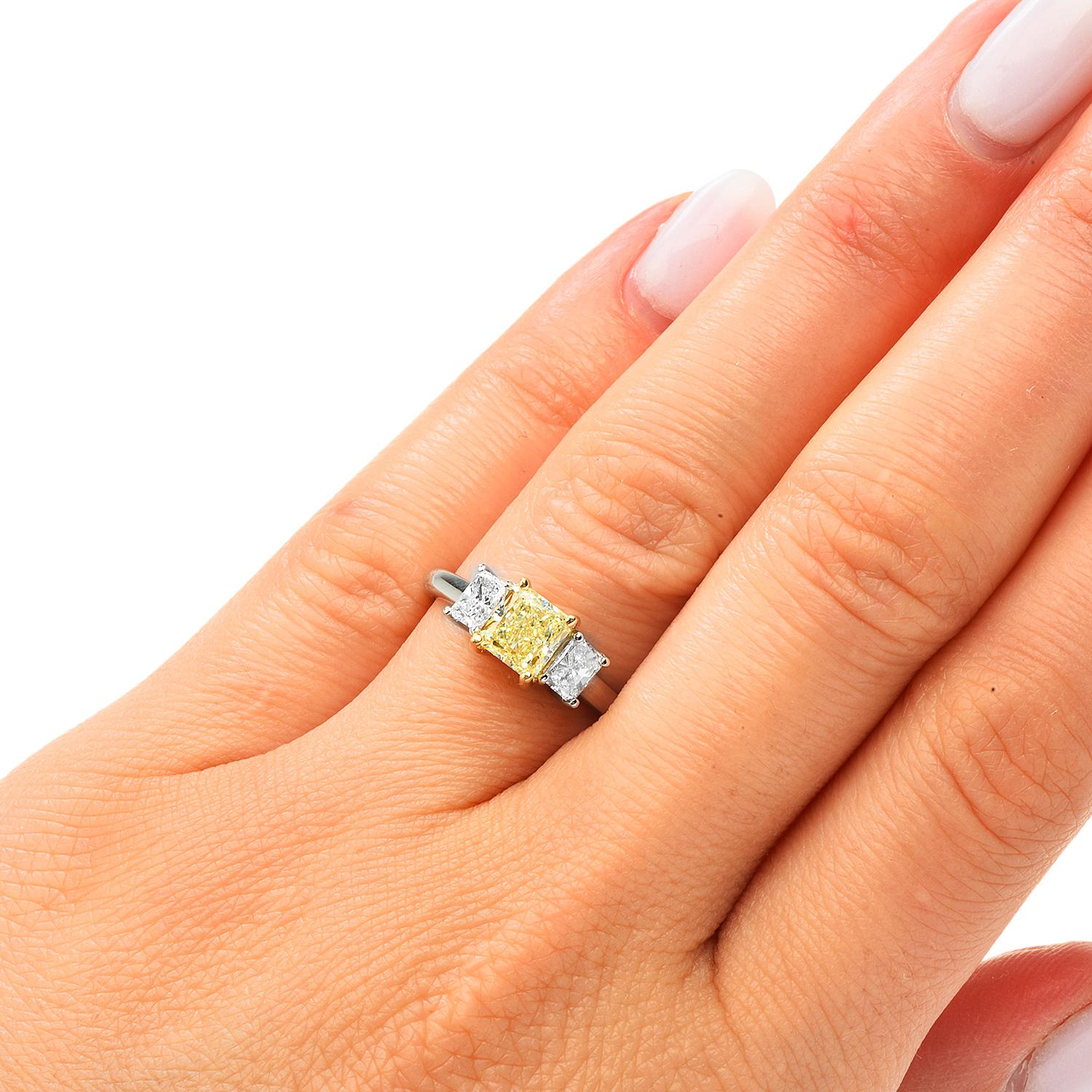 Vibrant Elegance &  sparkle.

Expertly crafted in solid Platinum, composed by exquisite GIA Certified Princess Cut Diamond 1.11 carats, natural W-X yellow color, VS1 Clarity), held by 18K Yellow Gold Prongs.

Complimented by two elongated