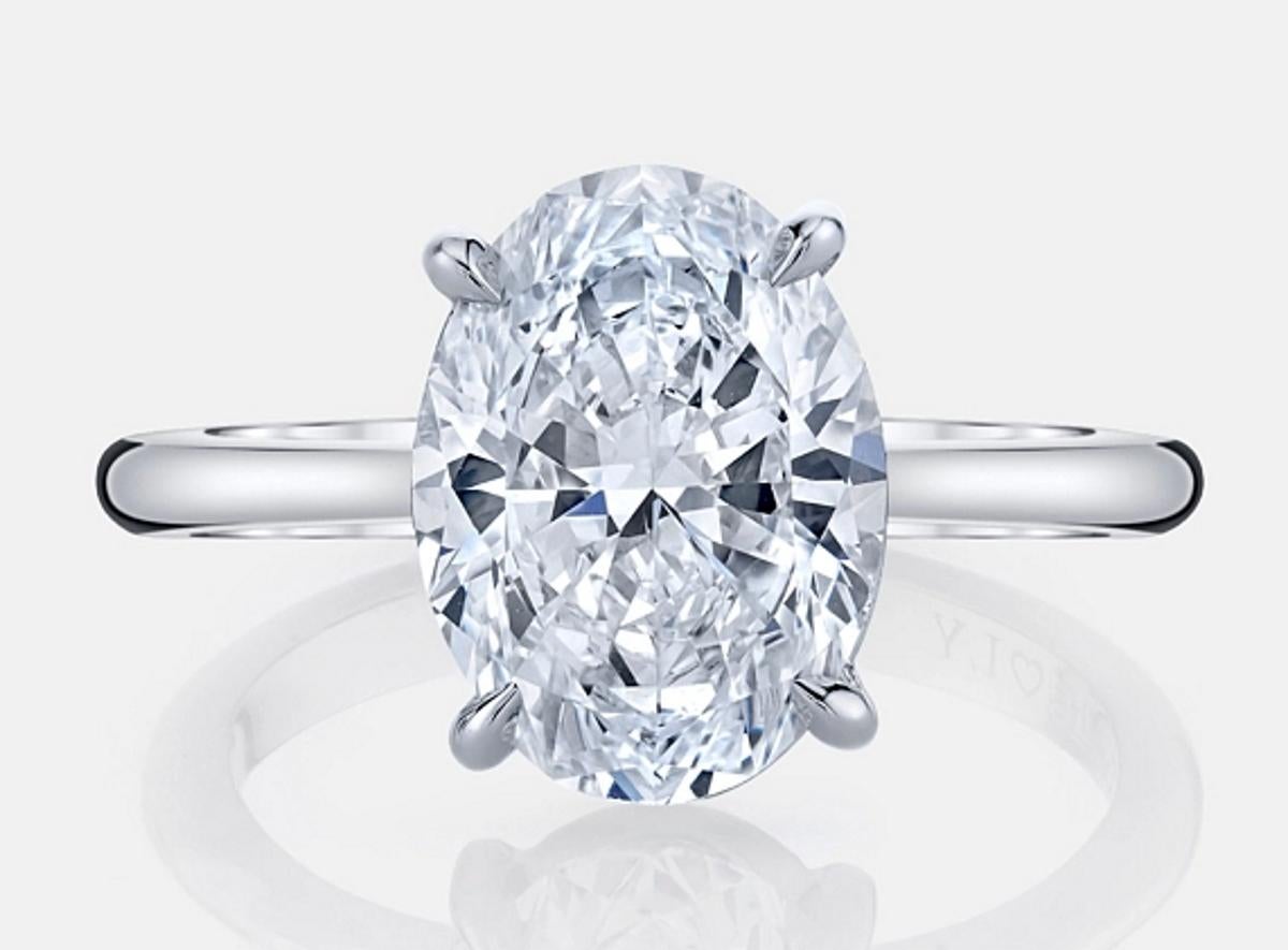 This eye-catching 1.50ct GIA certified oval cut diamond has perfect E color, a completely eye clean appearance, and gorgeous, lively brilliance! Oval cuts are one of the most fashionable and sought after diamond cuts, and its elongated shape is very