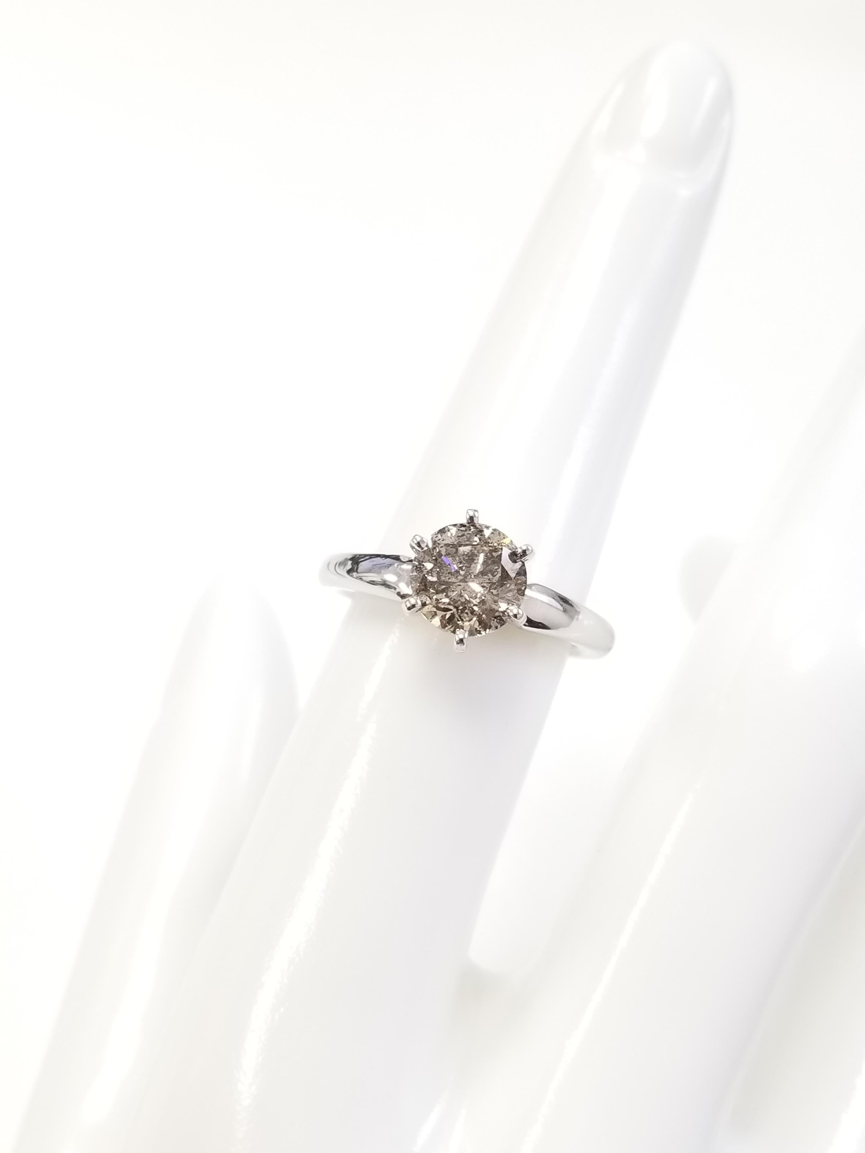 Natural fancy brown round diamond weighing 1.70 ct. Set on 6-prong 14K solitaire white gold.
Ring size: 6.5 (Free Resize)
