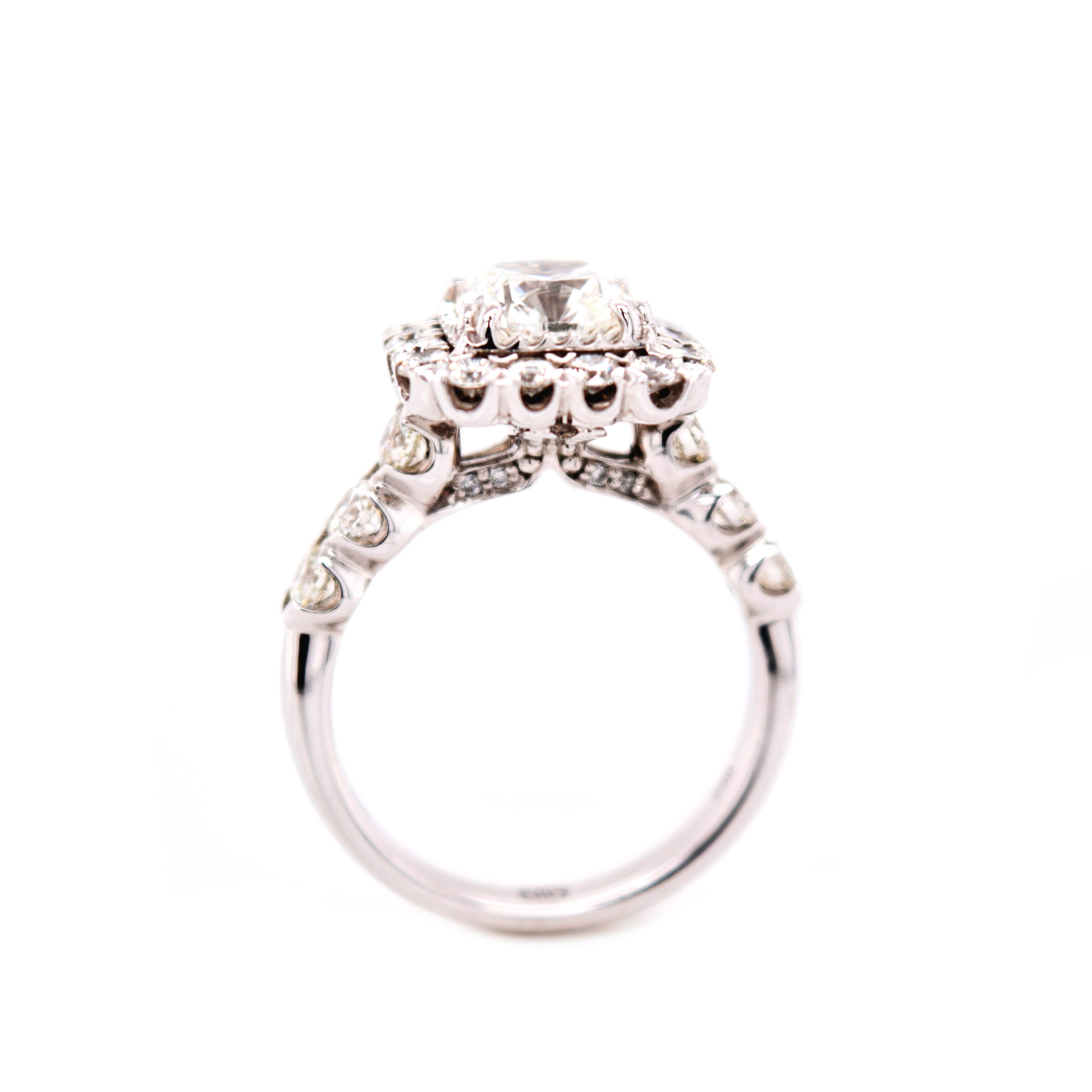 18 Karat White Gold Christopher Designs ring with stunning halo accenting the center diamond.  A wedding band will fit beautifully with this engagment setting. 

Center Fire Cushion Diamond  1.71 Carat H/I1 
GIA #5182154923

30 round Brilliant