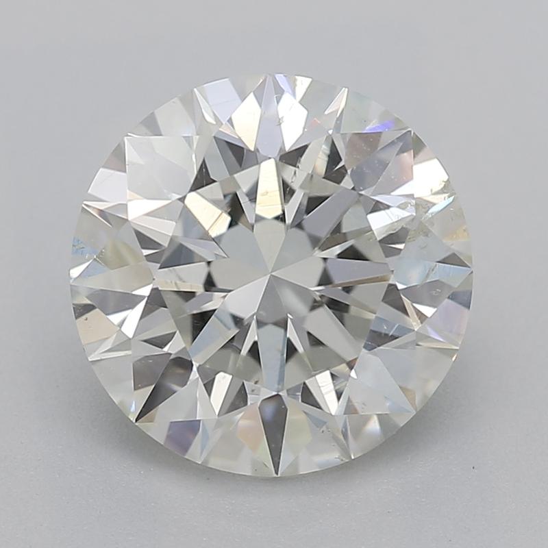 Experience the epitome of elegance with this radiant diamond ring, showcasing a magnificent round diamond weighing 1.71 , graded J and SI2. This stunning piece features a captivating four-prong setting, beautifully encased in a shimmering swirl