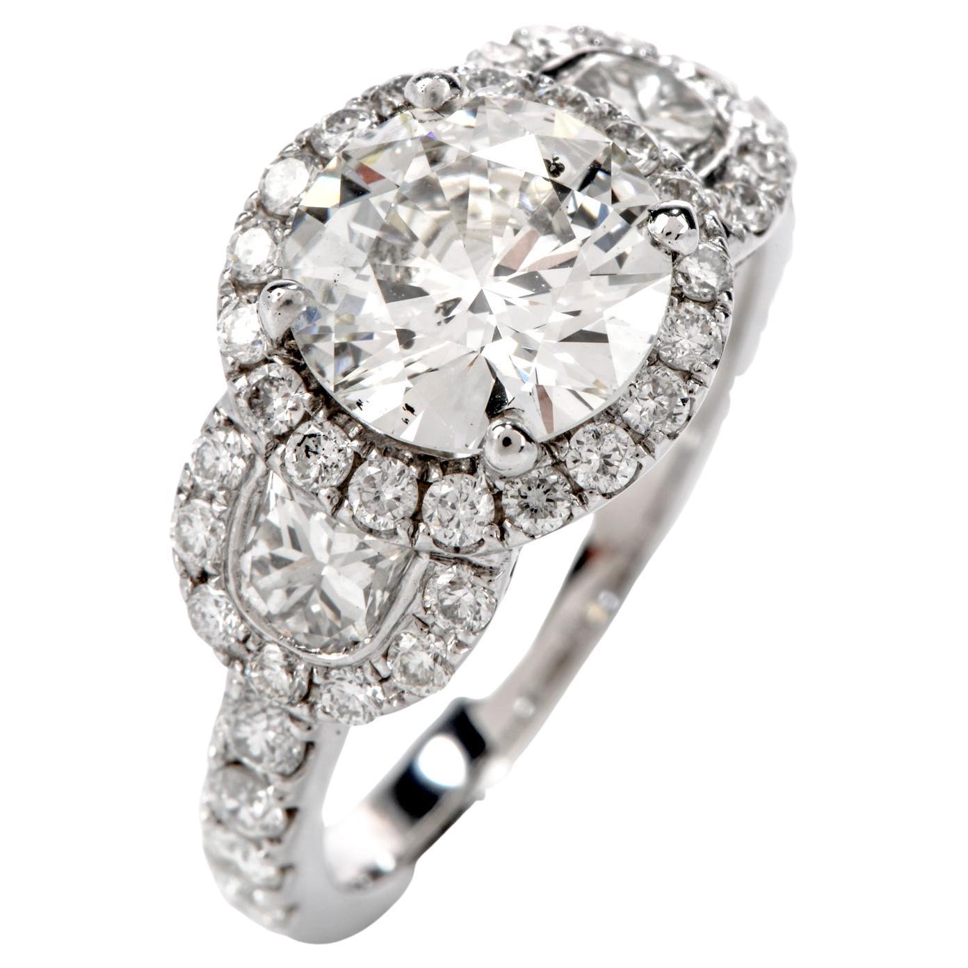 GIA 1.72 Carat Round Diamond 18 Karat Gold 3-Stone Halo Engagement Ring For Sale