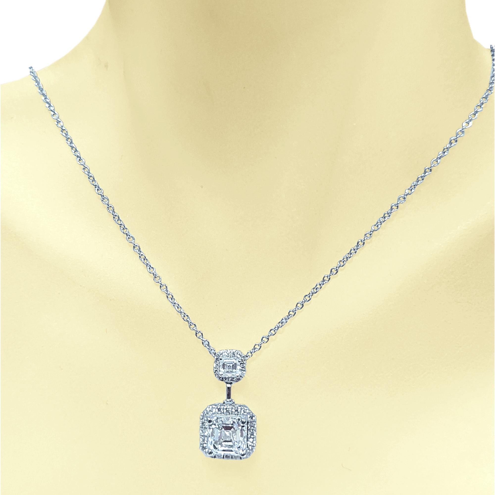 A beautiful F/VS2 GIA Certified 1.73 Ct Asscher cut (Square Emerald Cut) sits in the center of a Beautiful  handcrafter Duo Necklace design made in 18K Necklace. The second diamond is 0.20 Ct Asscher cut with  pave set Halos set with 35 Perfectly