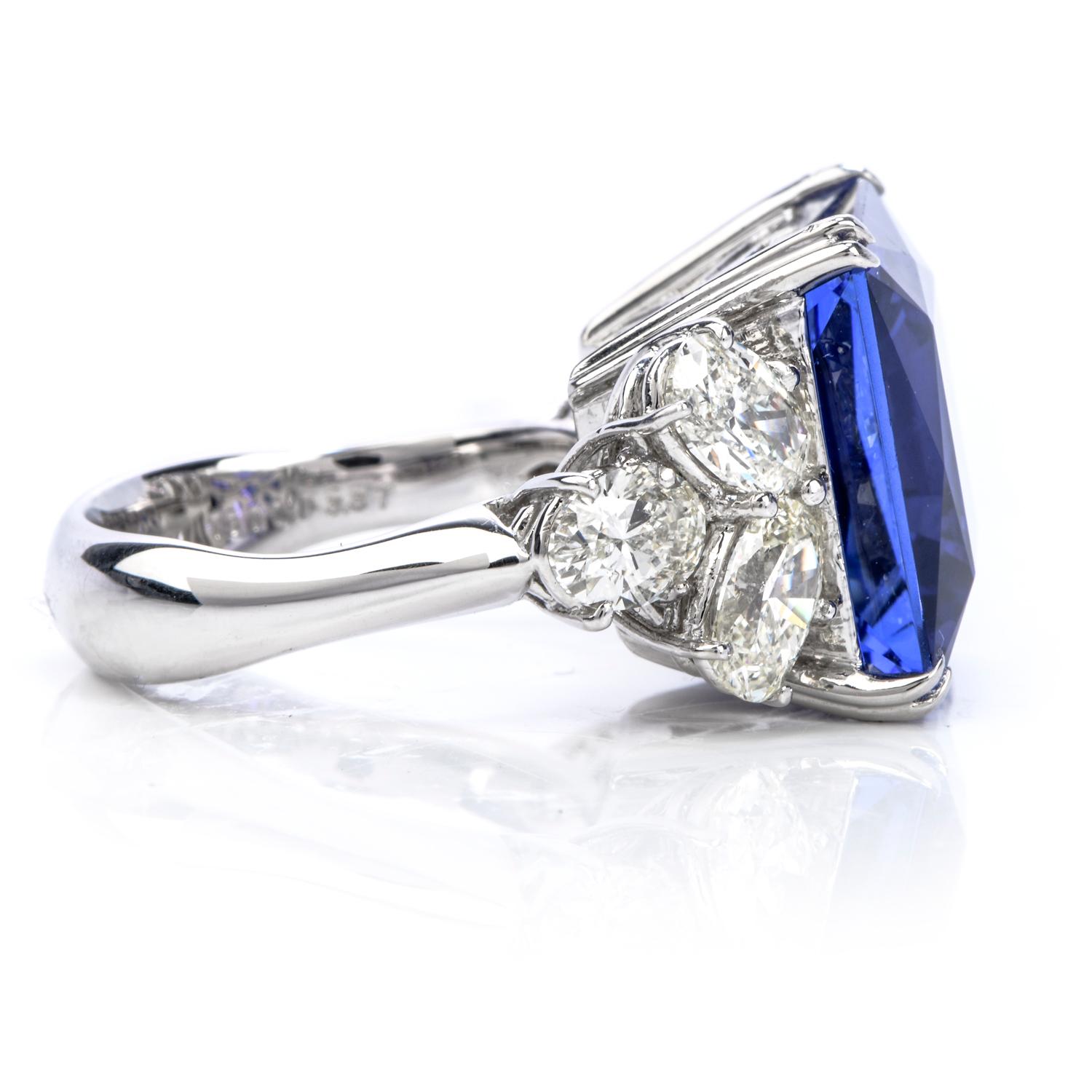This magnificent dazzling Estate piece is crafted in Pt800 solid Platinum and is centered with a vivid square cut GIA certified Tanzanite of 18.01 carats, prong set.

The beautiful color of the center stone is all the more enhanced by 6 genuine pear