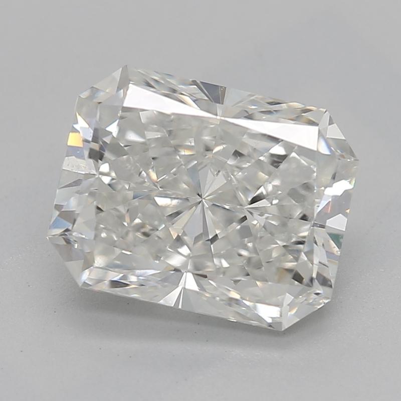 Handcrafted in New York, a stunning diamond ring that exemplifies timeless beauty and sophistication, featuring a captivating radiant center stone weighing 1.80 with a striking I and clarity of SI1. Its classic three-stone design is enhanced by two