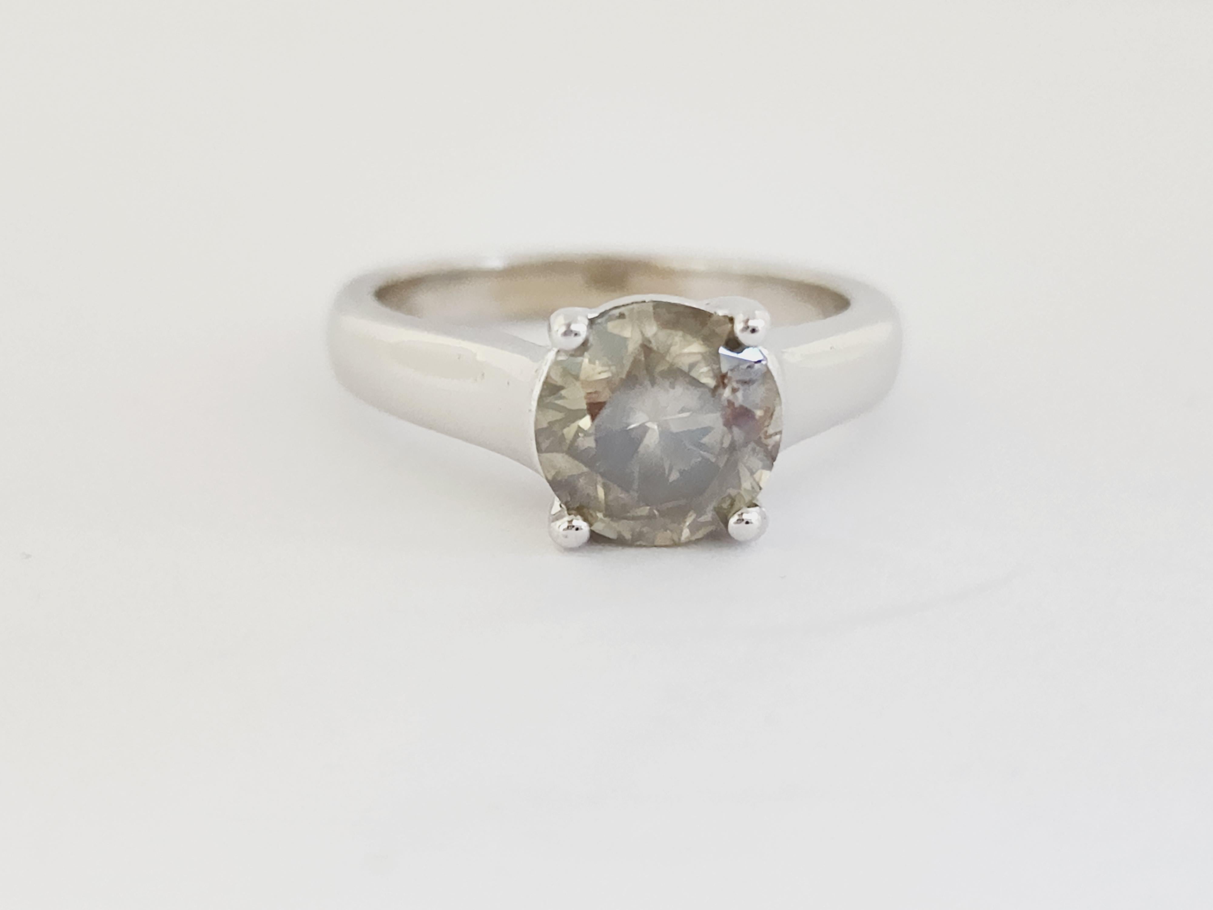 Natural GIA 1.84 Carat Fancy Dark Greenish Yellow-Brown Round Diamond Ring 14 Karat White Gold. Set on 4-prong 14K white gold ring.
Ring size: 6.5