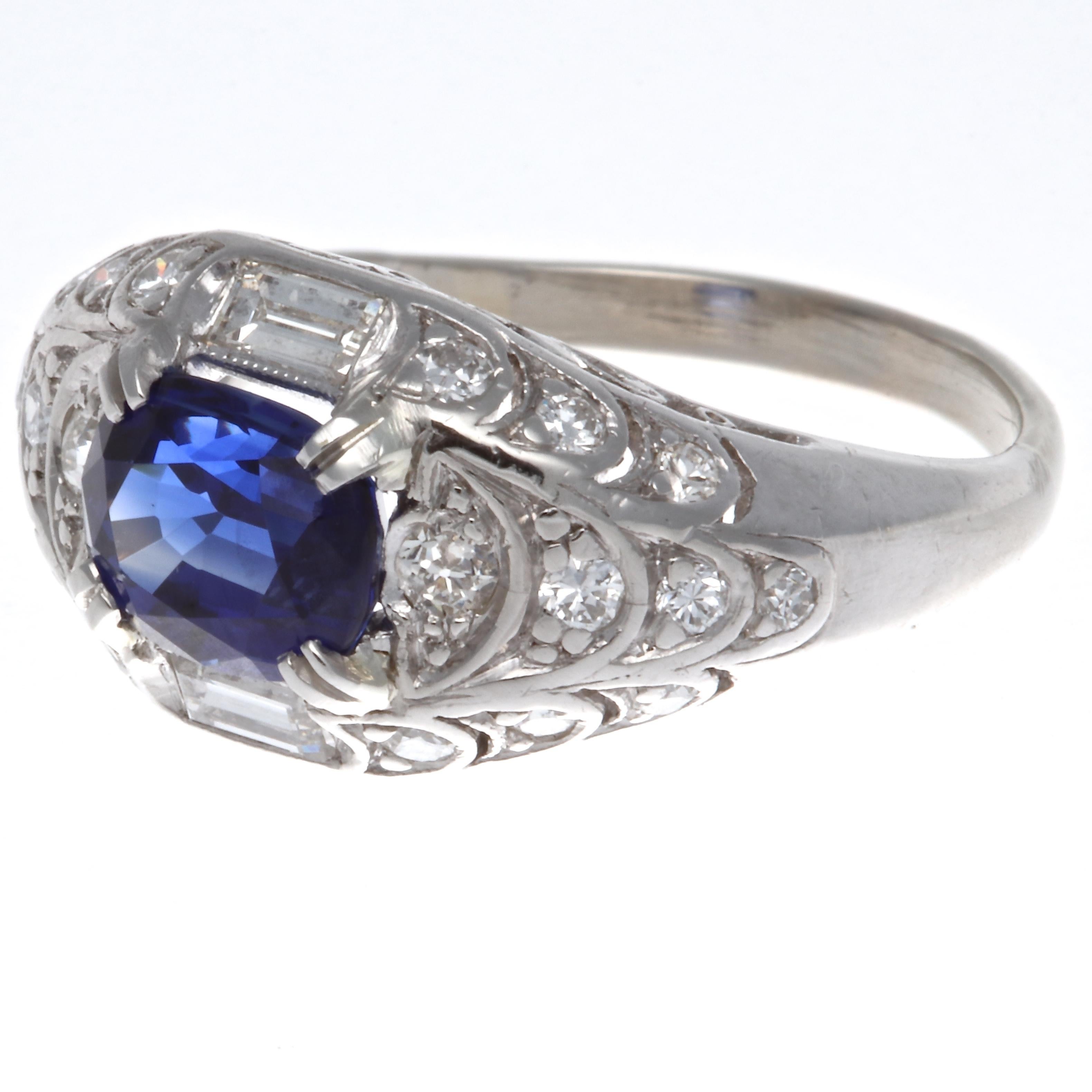 Modern GIA 1.84 carat Madagascar heated sapphire diamond platinum three stone ring. Accented by two trillion cut diamonds weighing approximately 0.41 carats, H-I color, VS clarity. Circa 2000s. The ring is crafted in platinum, size 6 1/2 and may be