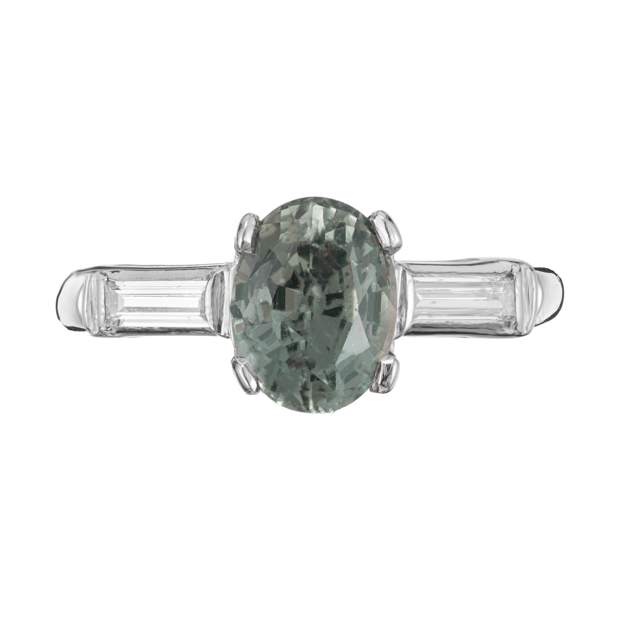 1940's late Art Deco natural green sapphire and diamond engagement ring. This beautiful rich green 1.85ct oval center sapphire is certified by the GIA as natural, no heat, green with a hint of blue. Mounted in a platinum original 1940's setting and