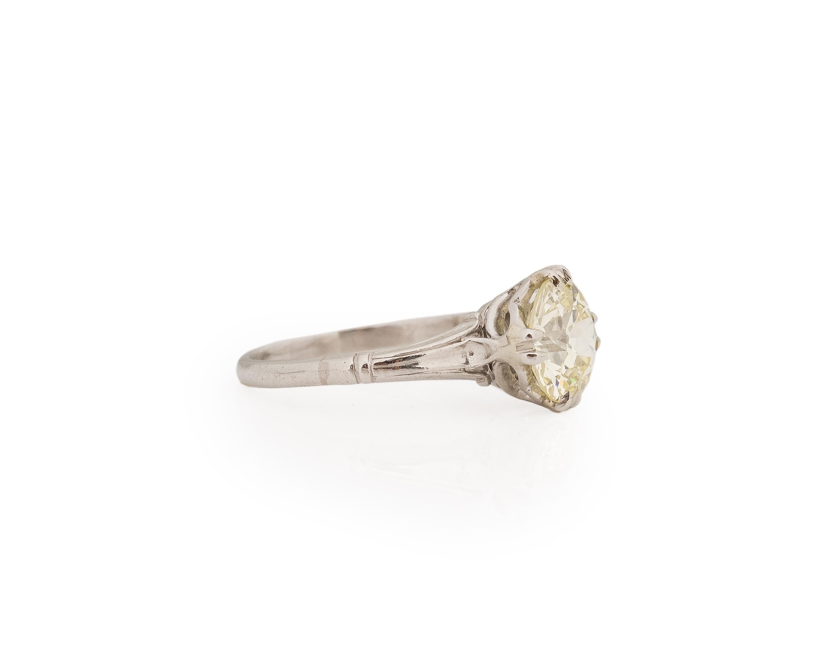Year: 1920s

Item Details:
Ring Size: 5.5
Metal Type: Platinum [Hallmarked, and Tested]
Weight: 3.7 grams

Diamond Details:

GIA Report#:2235085234
Weight: 1.86ct total weight
Cut: Old European brilliant
Color: Light Yellow (U-V)
Clarity: VS1
Type: