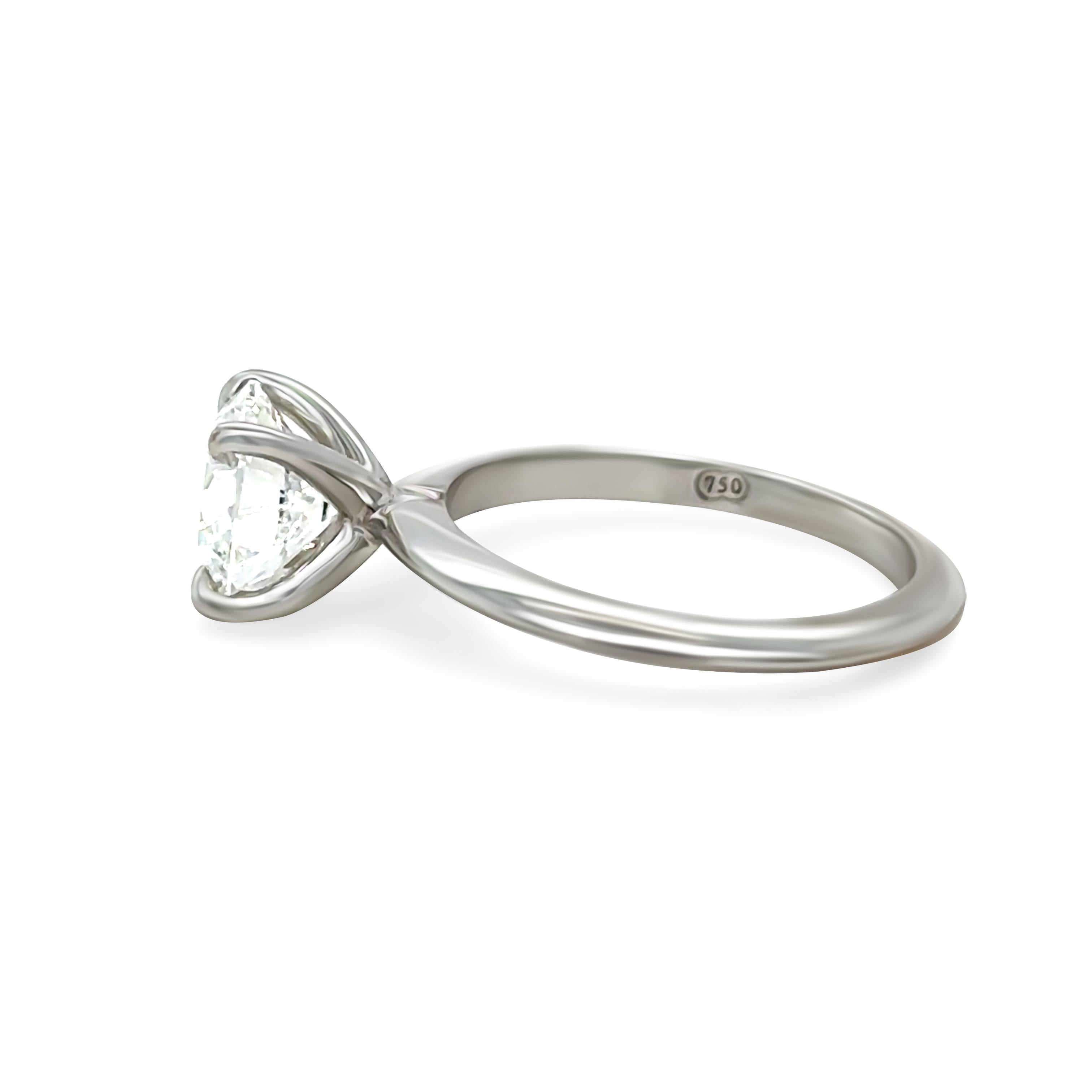 This breathtaking 18ct white gold GIA diamond engagement ring showcases a 1.51ct round brilliant-cut diamond, graded D colour and VVS2 clarity, ensuring unmatched brilliance and purity. Expertly crafted, the diamond is secured in a refined setting