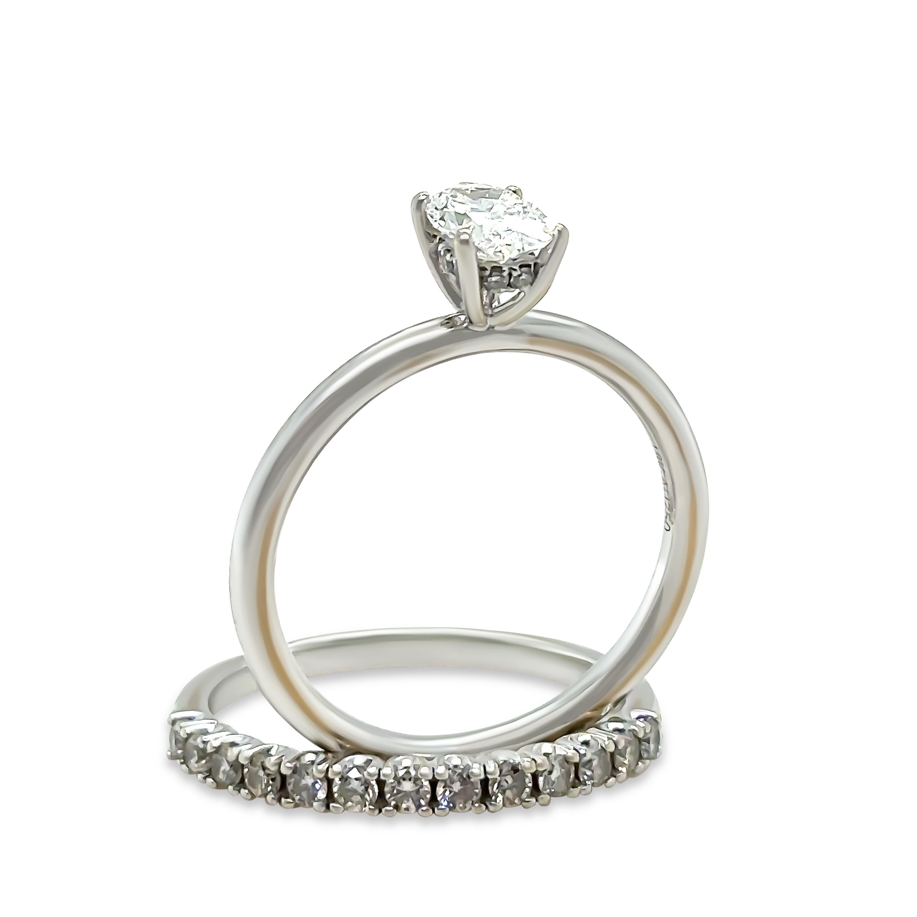 A Bespoke GIA Diamond Engagement Ring Set, made of 9ct & 18ct White Gold. The engagement ring features a Solitaire Oval Brilliant Cut Diamond in a four claw configuration with 10 small Round Brilliant cut diamonds on the underail to a 1.9mm Band.