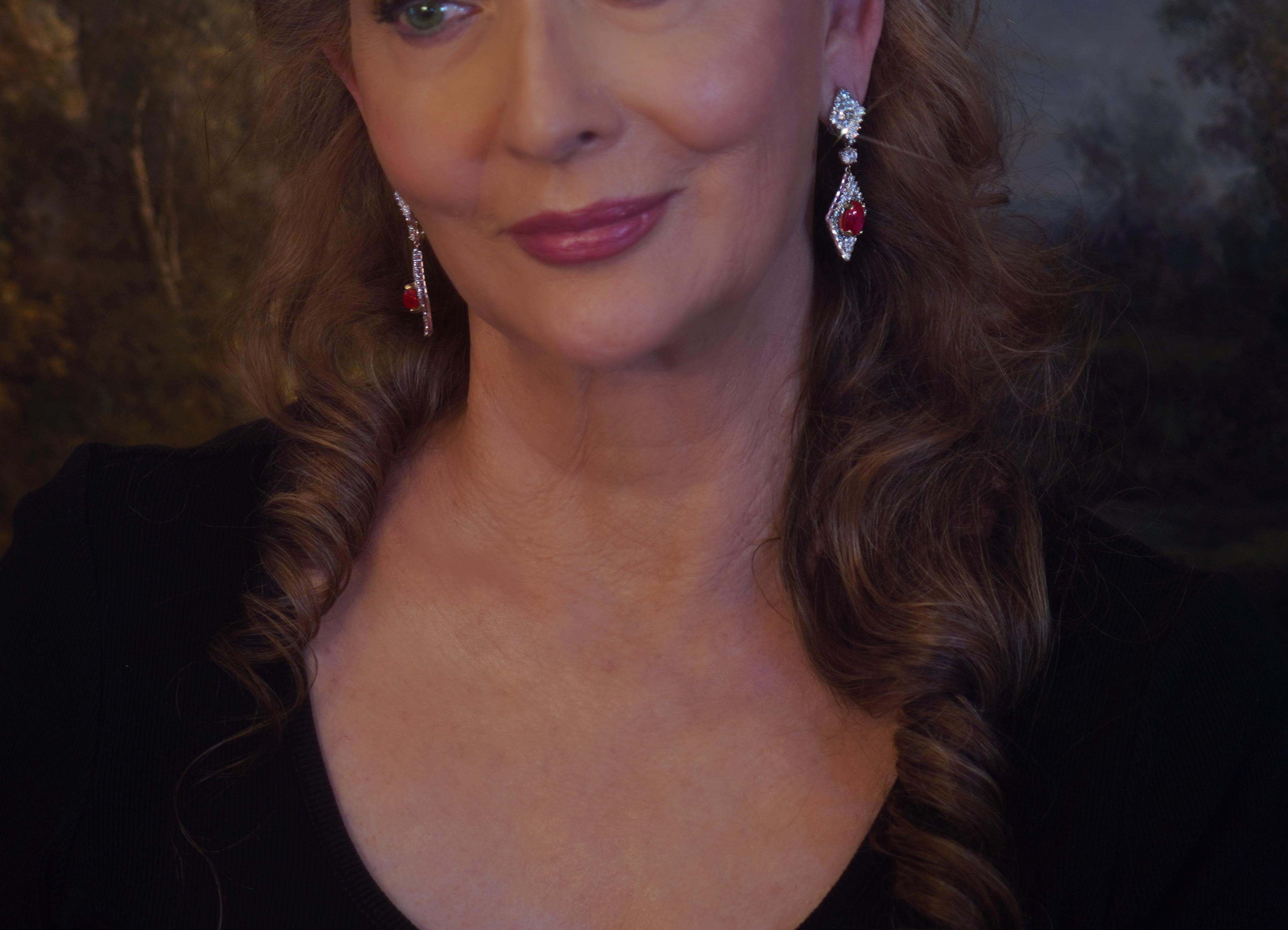 Old South Jewels proudly presents GIA CERTIFIED 18K RED NO HEAT RUBY DIAMOND 19.94 CARAT VINTAGE DAY/NIGHT EARRINGS!  Fine 14.48 Carats Rich Red Star Rubies Crowned With 5.46 Carats of Sparkling VVS Diamonds White Eye Clean Diamonds.

Gorgeous Long