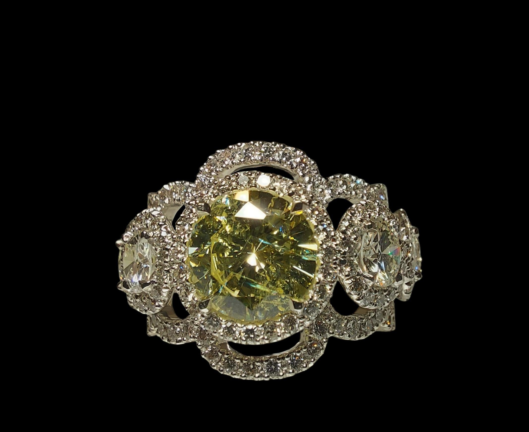 GIA Amazing 18kt White Gold Ring With 2 ct Fancy Yellow Diamond and 4.2 ct Surrounding Diamonds

Diamond: Round brilliant cut, natural, fancy yellow diamond 2ct
Comes with GIA Certificate for the center stone.

4 big brilliant cut diamonds together