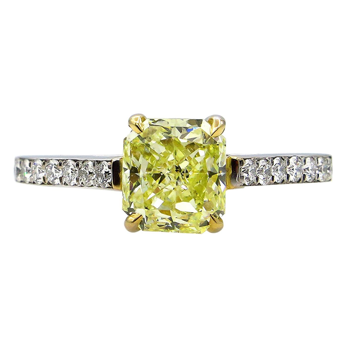 GIA 1.98 Carat Fancy Yellow Radiant Cut Diamond Solitaire Platinum Ring For Sale