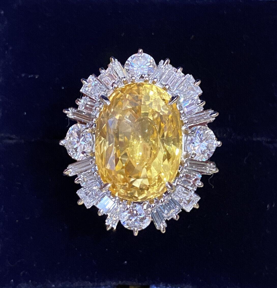GIA Certified 19.89 Carat Unheated Yellow Sapphire and Diamond Ring in Platinum

Yellow Sapphire and Diamond Ring features a large Natural Oval Yellow Sapphire in the center surrounded by Round and Tapered Baguette Diamonds set in platinum. 

The