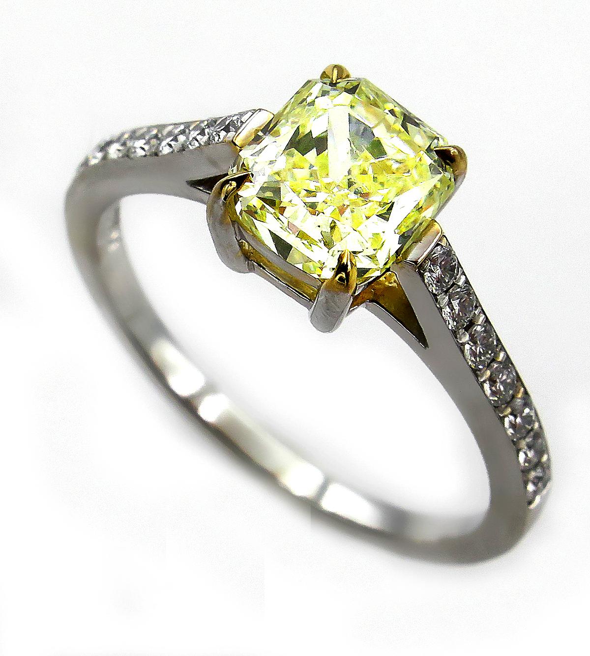 GIA 1.98 Carat Fancy Yellow Radiant Cut Diamond Solitaire Platinum Ring In Good Condition For Sale In New York, NY